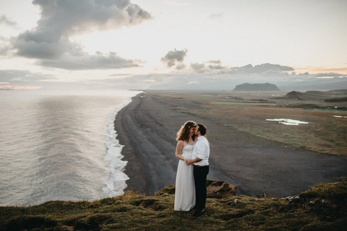 bride and groom hug after a hike