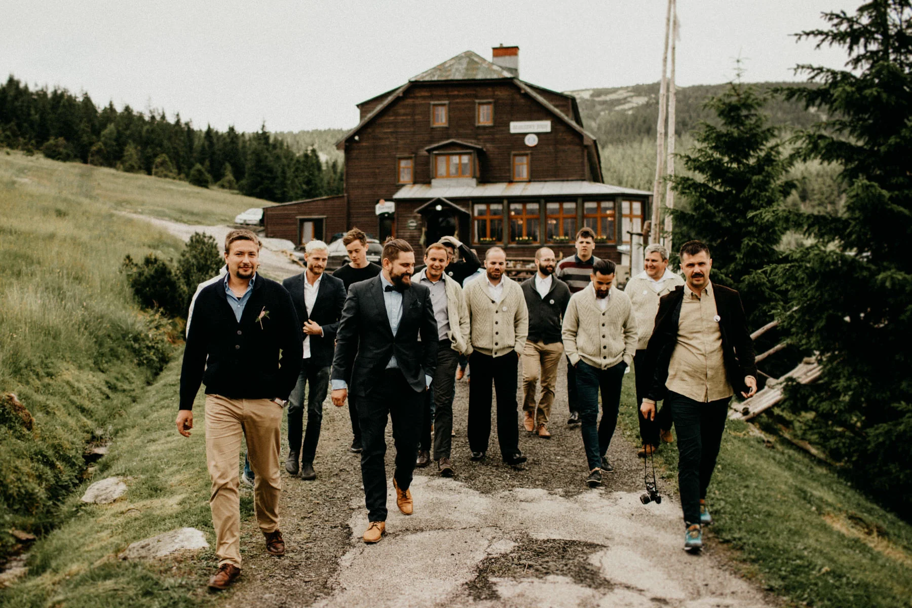 groom with his groomsmen walking to their secret spot