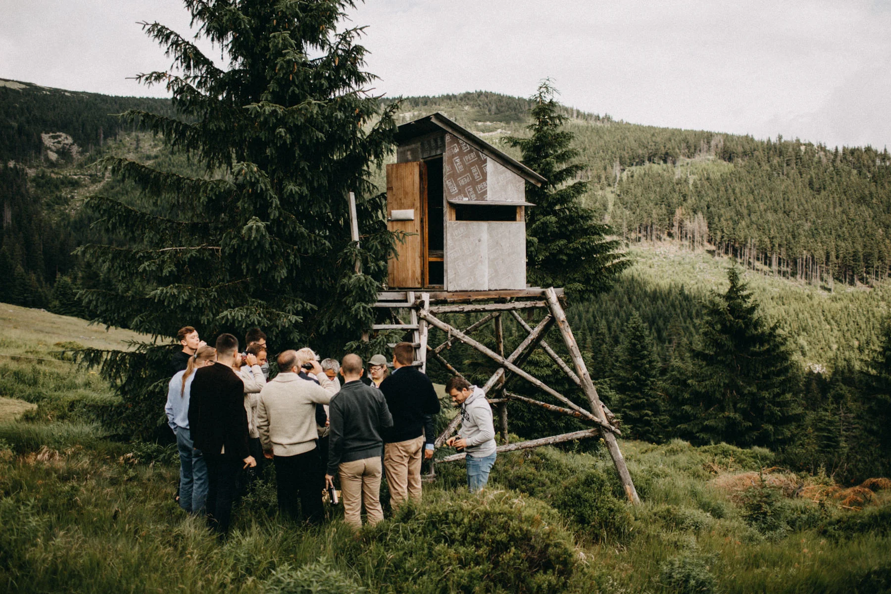 groomsmen drinking beer in the forest