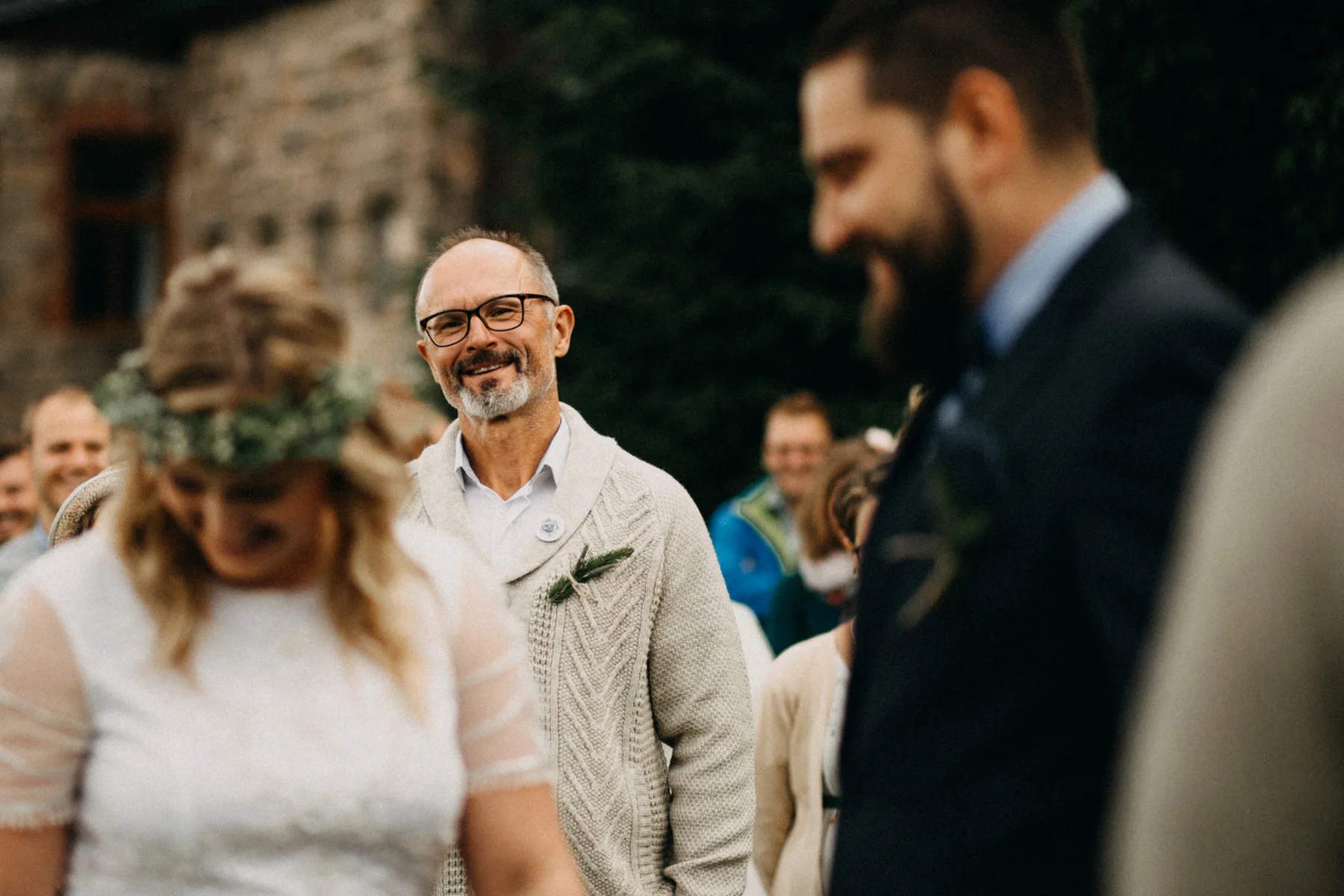 proud dad looking at the ceremony
