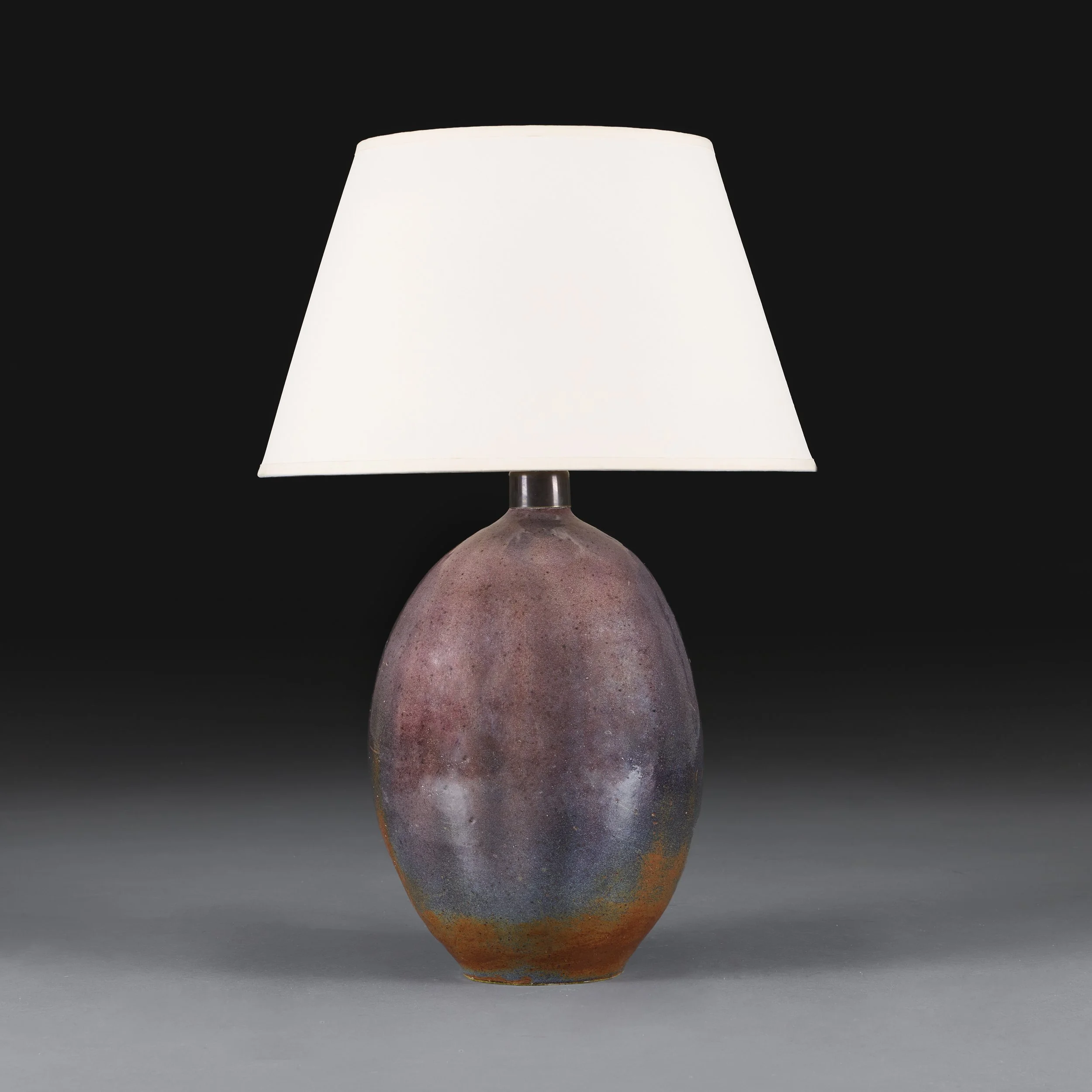 A MAUVE LUSTRE ART POTTERY LAMP