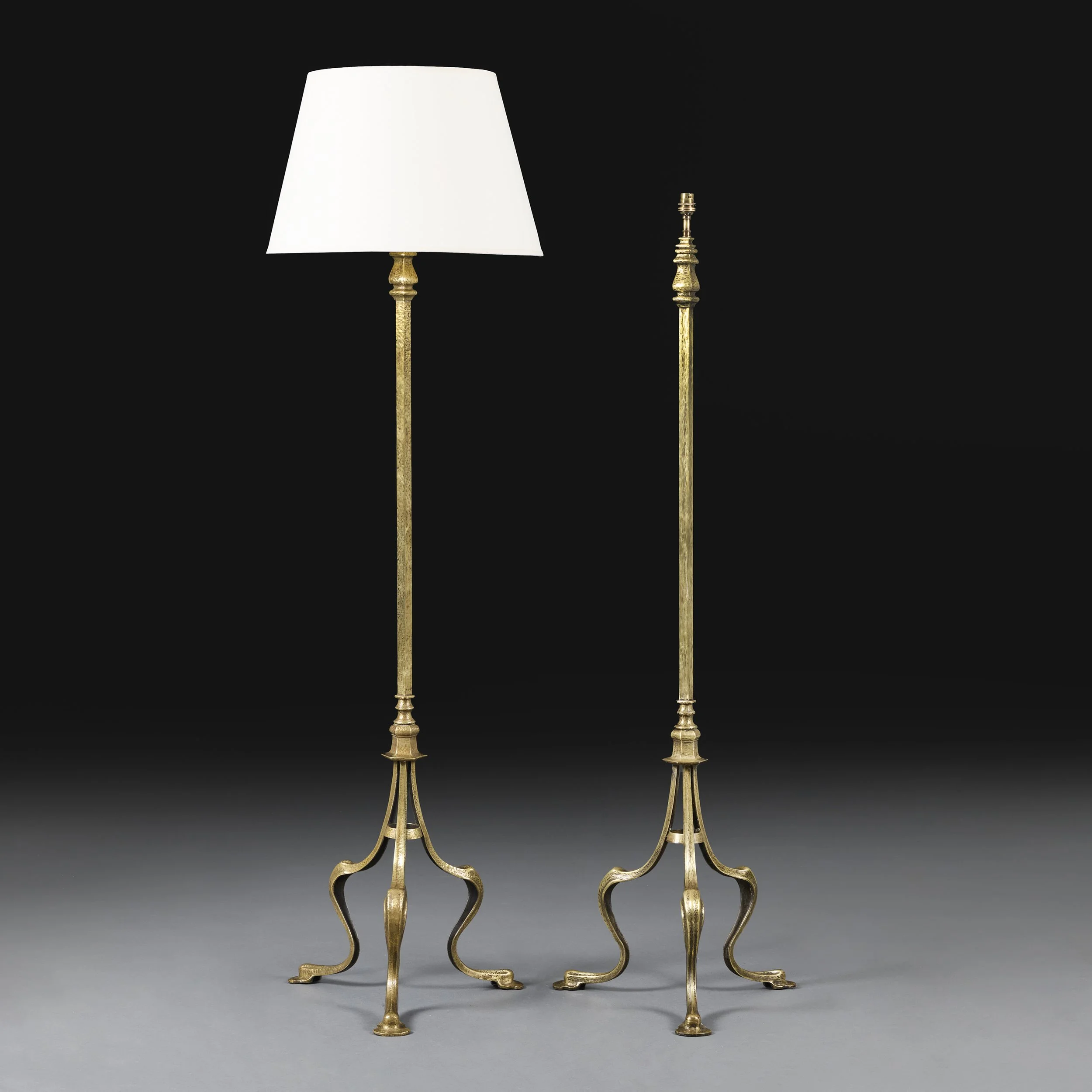 A PAIR OF BRASS ARTS & CRAFTS STANDARD LAMPS
