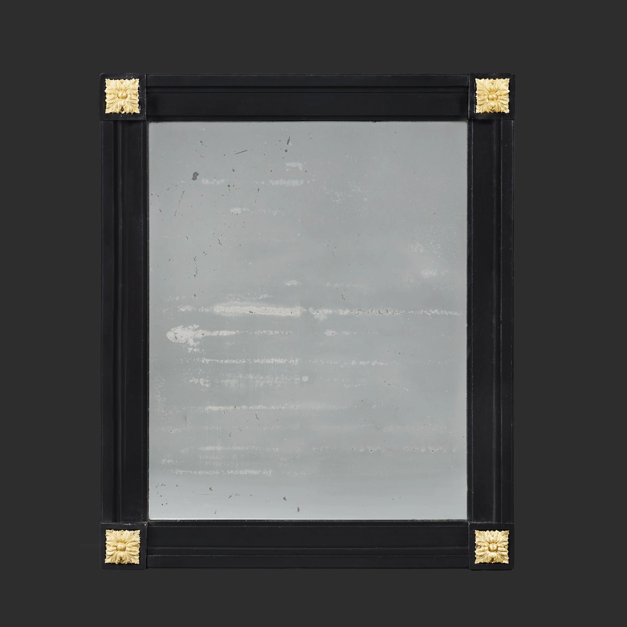 A 19TH CENTURY FRENCH EBONISED MIRROR