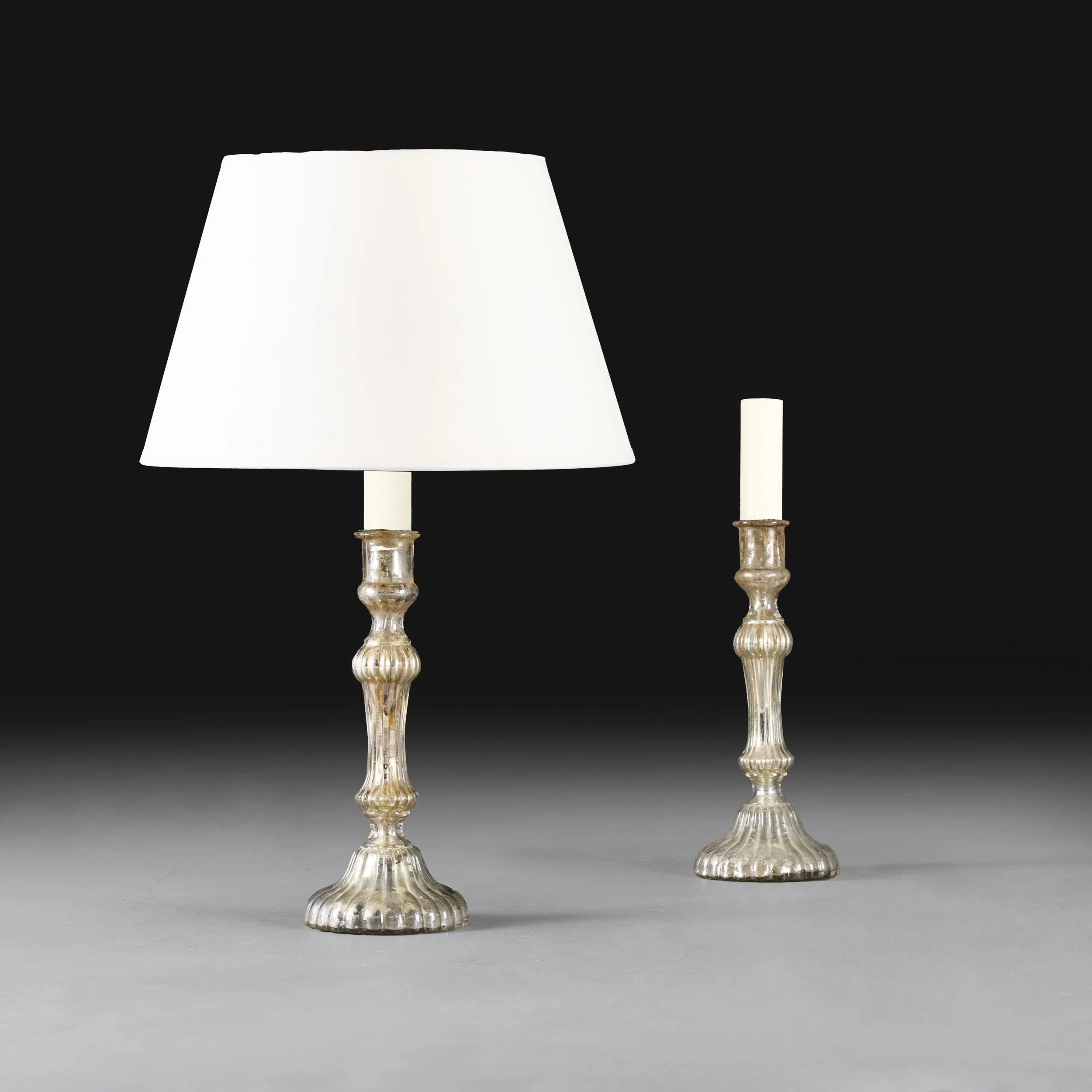 A PAIR OF MERCURY GLASS CANDLESTICK LAMPS