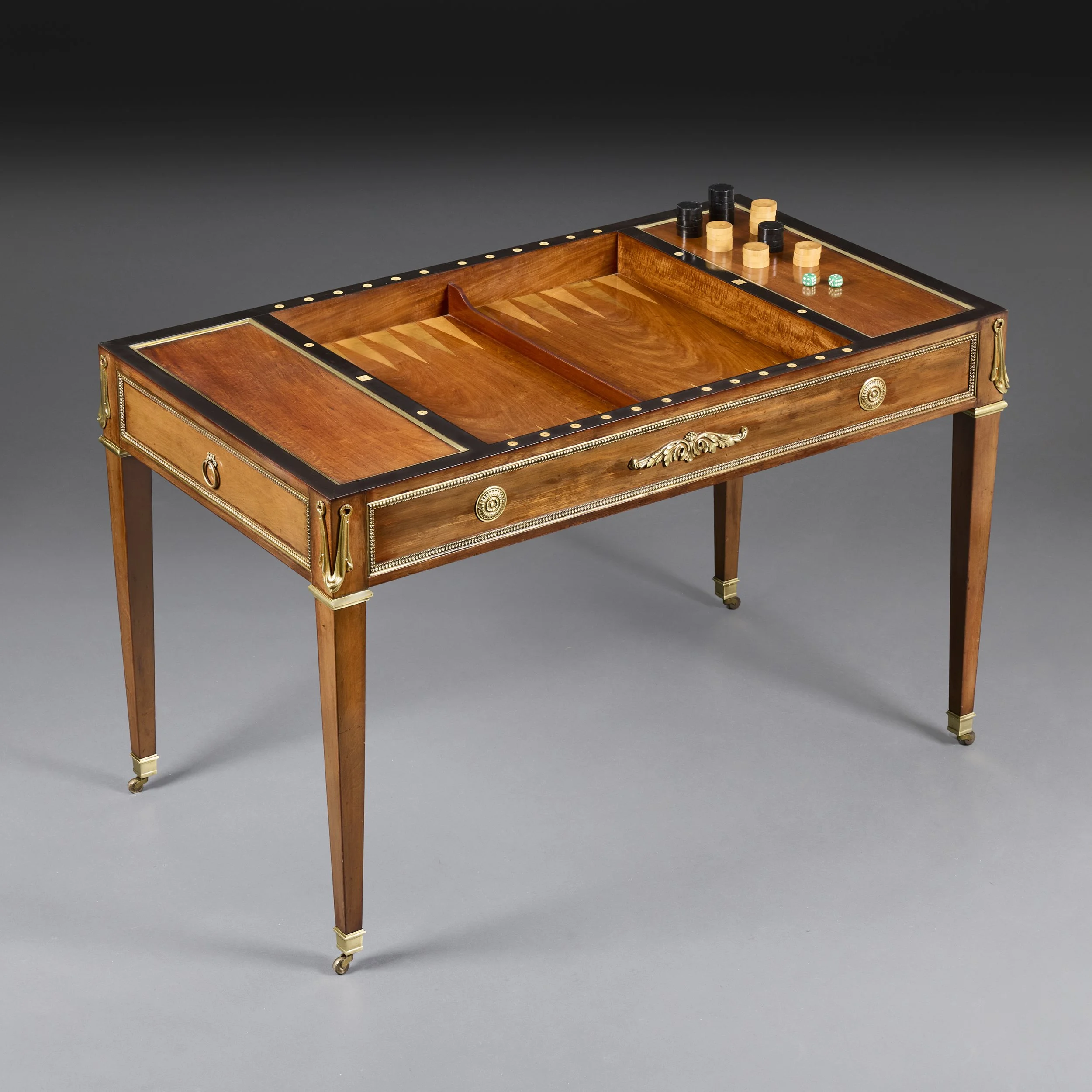 AN EXCEPTIONAL SATINWOOD TRIC TRAC TABLE