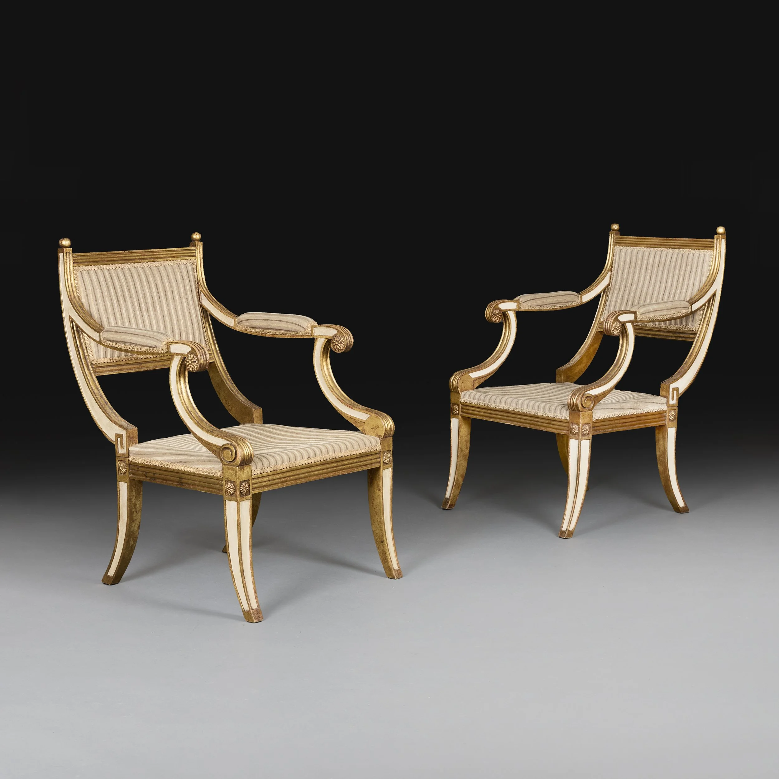 A PAIR OF REGENCY STYLE ARMCHAIRS