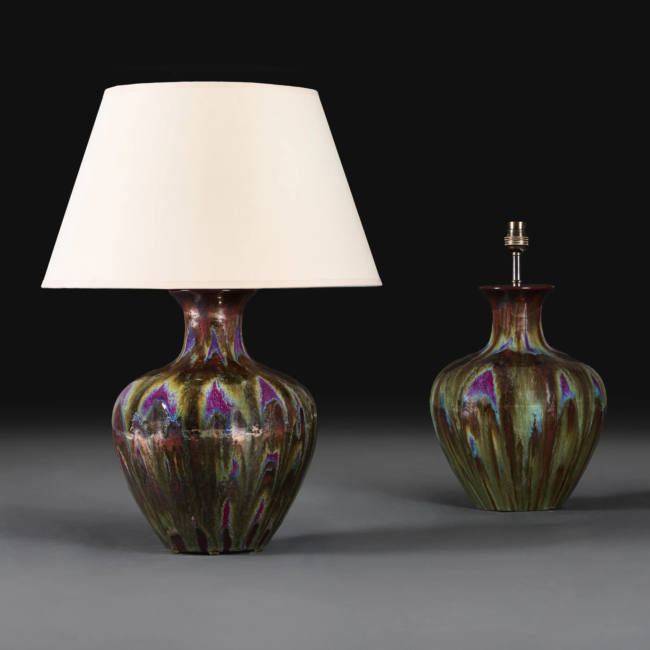 A PAIR OF ART NOUVEAU BRONZE FLAMBÉ LAMPS