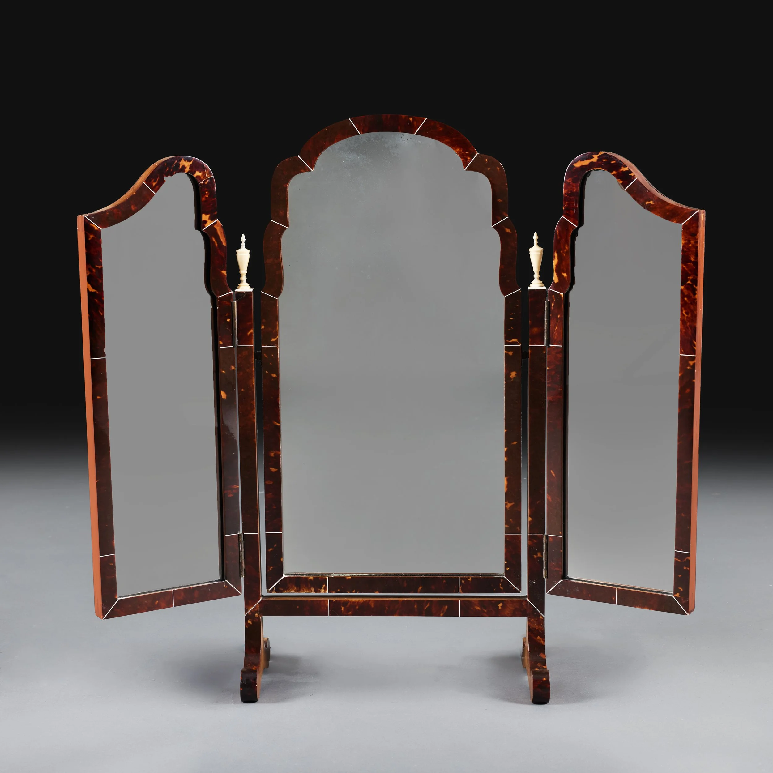 AN EDWARDIAN TORTOISESHELL AND IVORINE DRESSING MIRROR