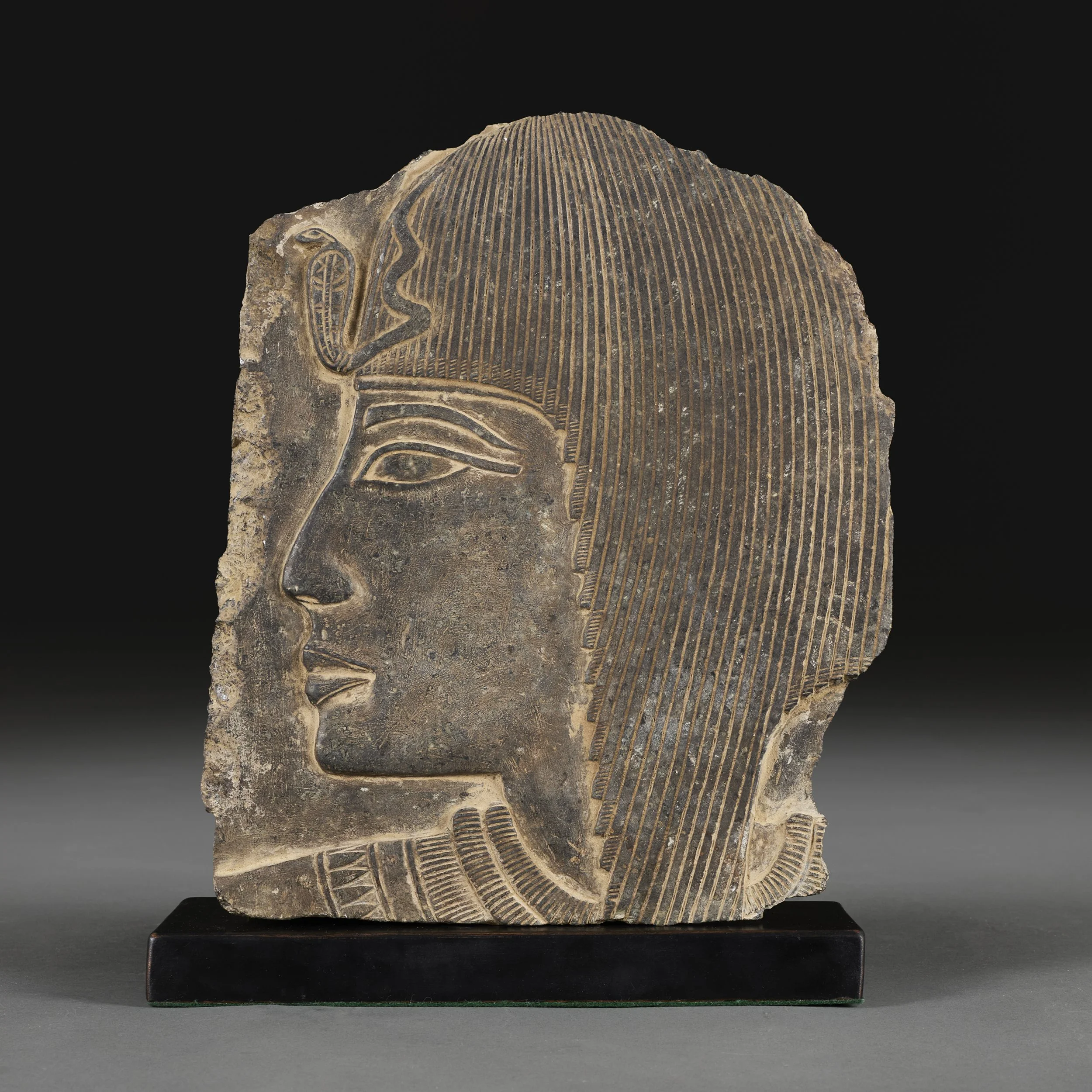 AN EGPTIAN REVIVAL CARVED GRANITE FRAGMENT