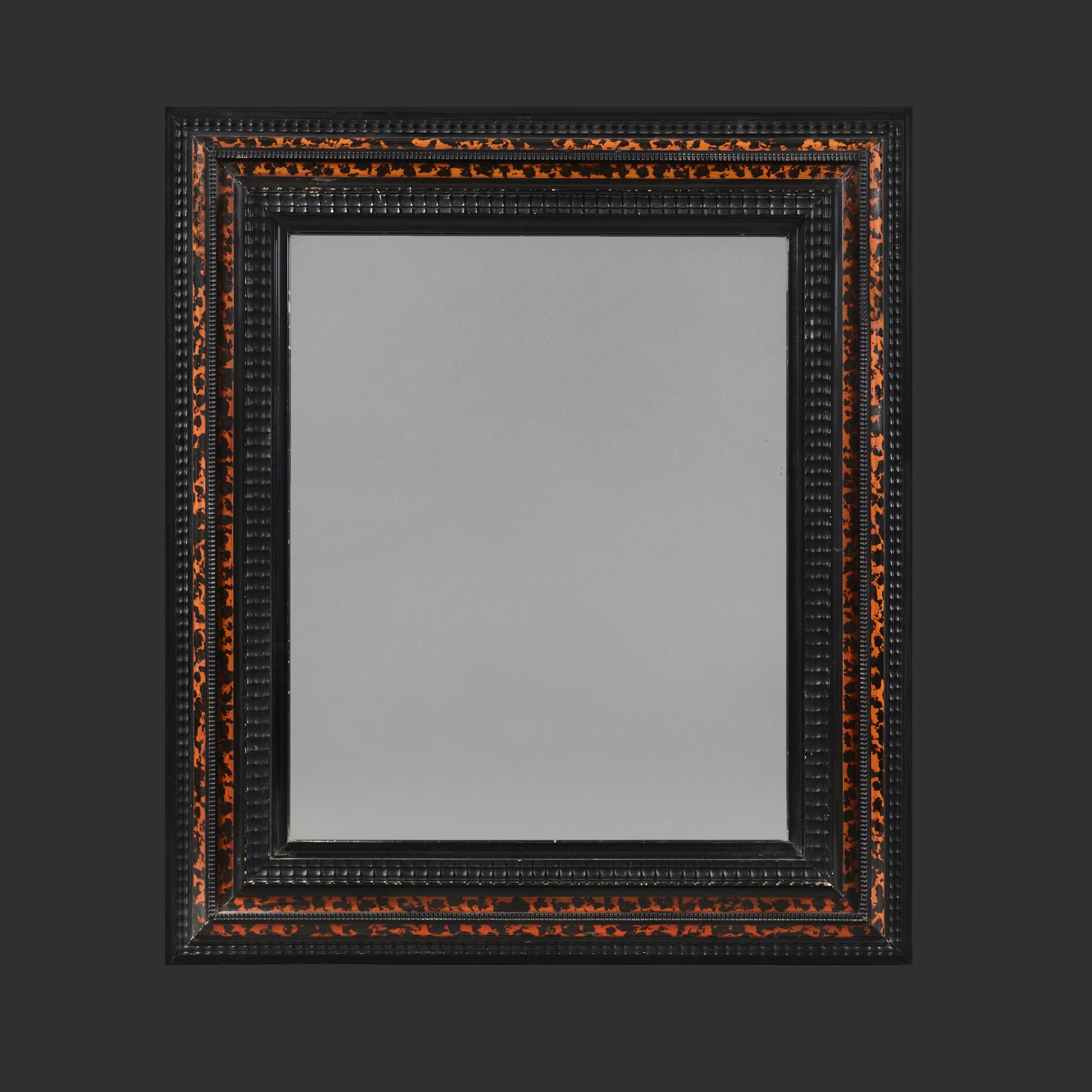 A FAUX TORTOISESHELL RIPPLE MOULD MIRROR