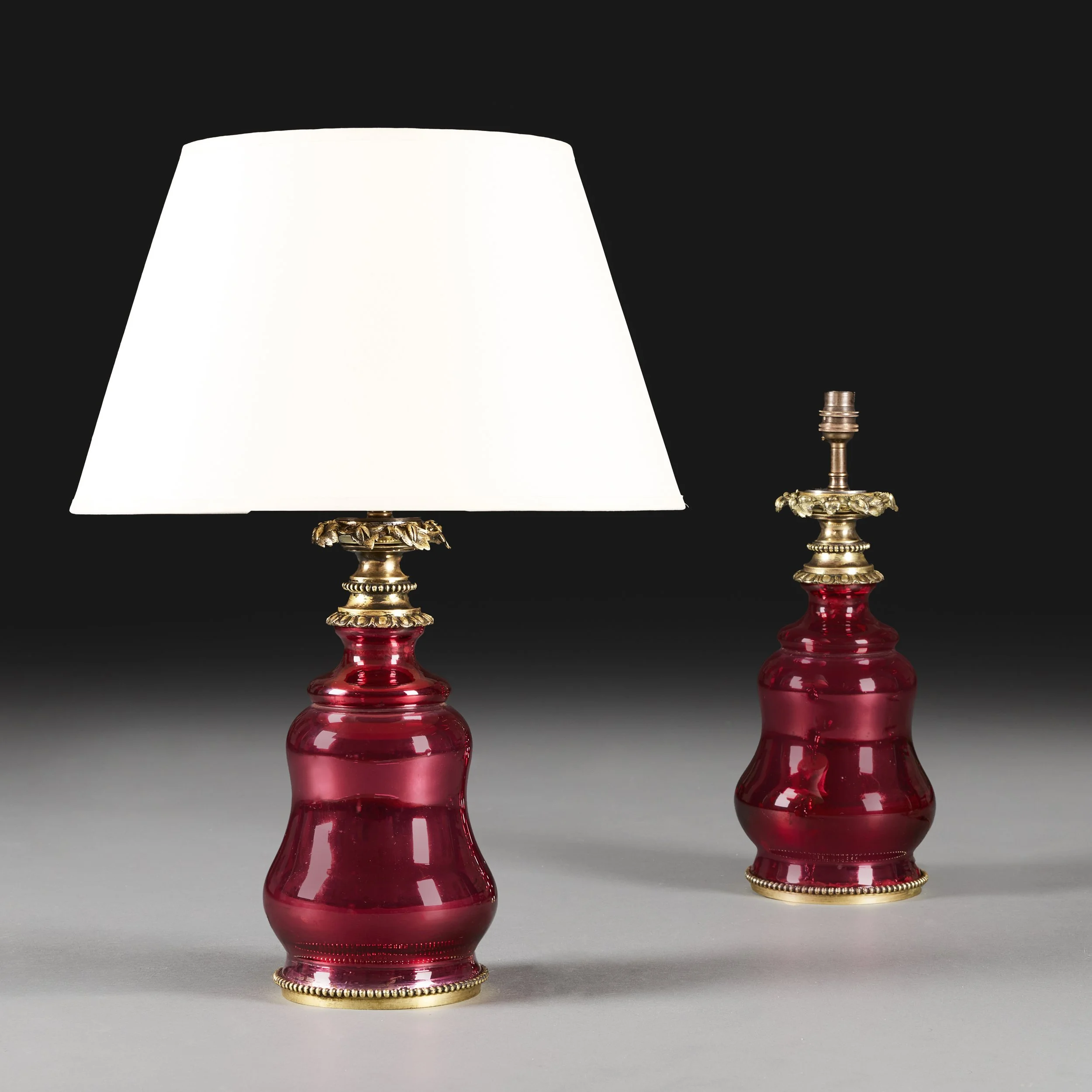 A PAIR OF PINK LUSTRE GLASS LAMPS