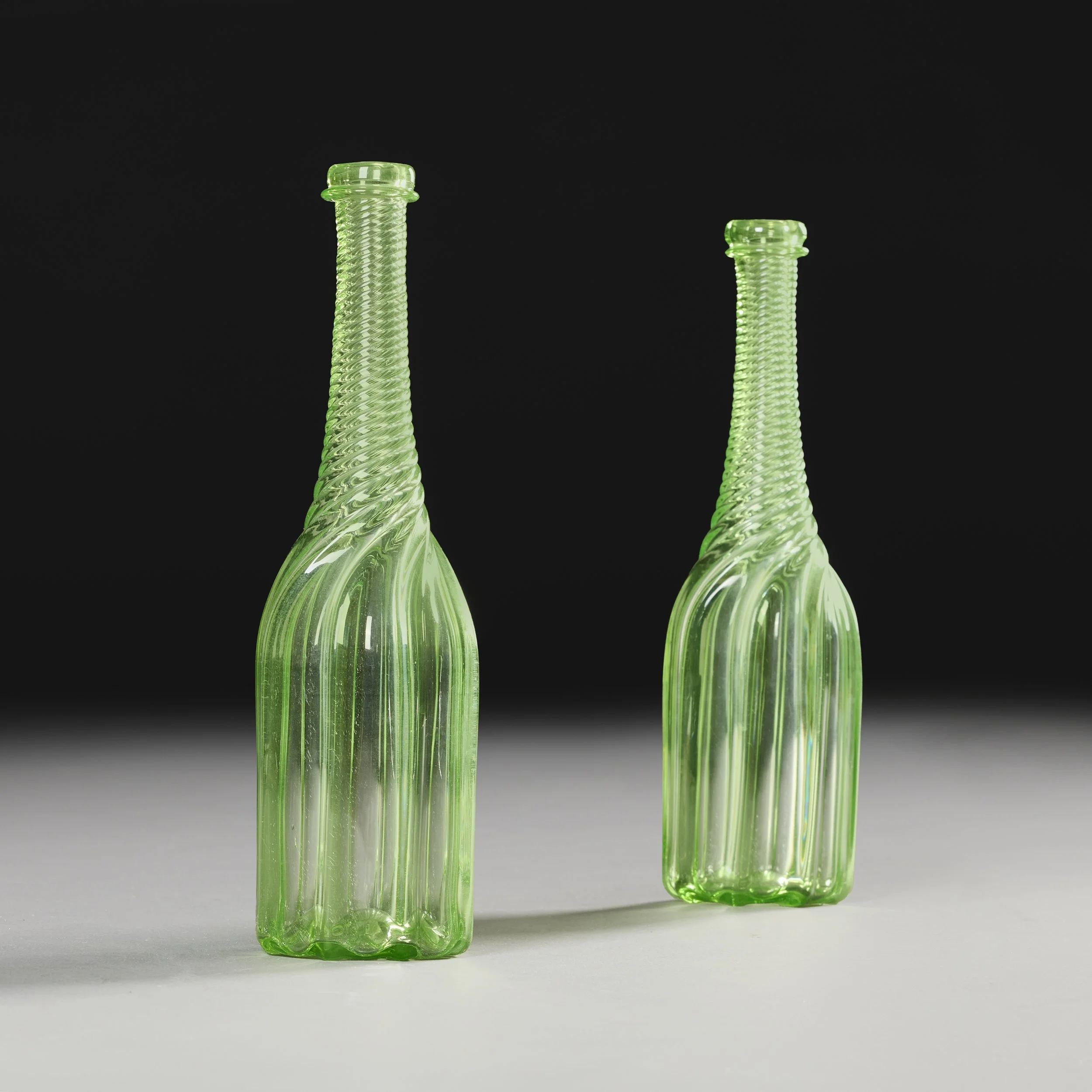 A PAIR OF 19TH CENTURY URANIUM GLASS BOTTLES