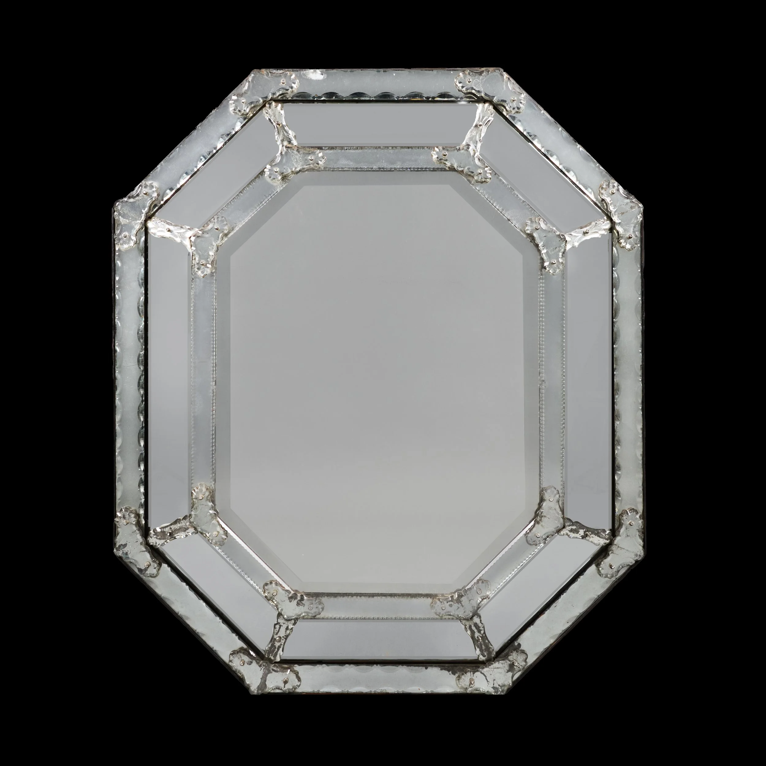 A FINE 19TH CENTURY CUSHIONED OCTAGONAL MIRROR
