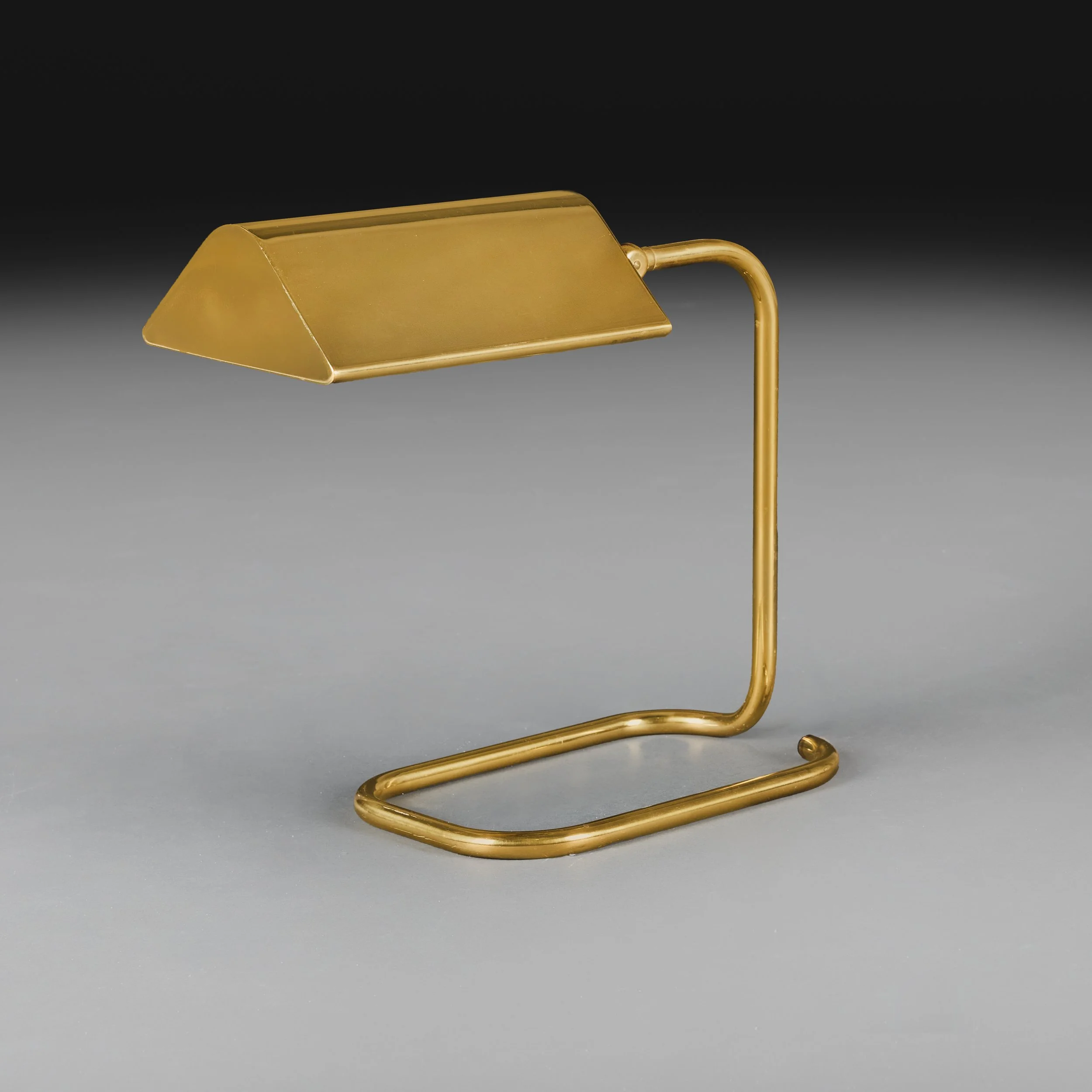 A BRASS DESK LAMP AFTER CEDRIC HARTMAN