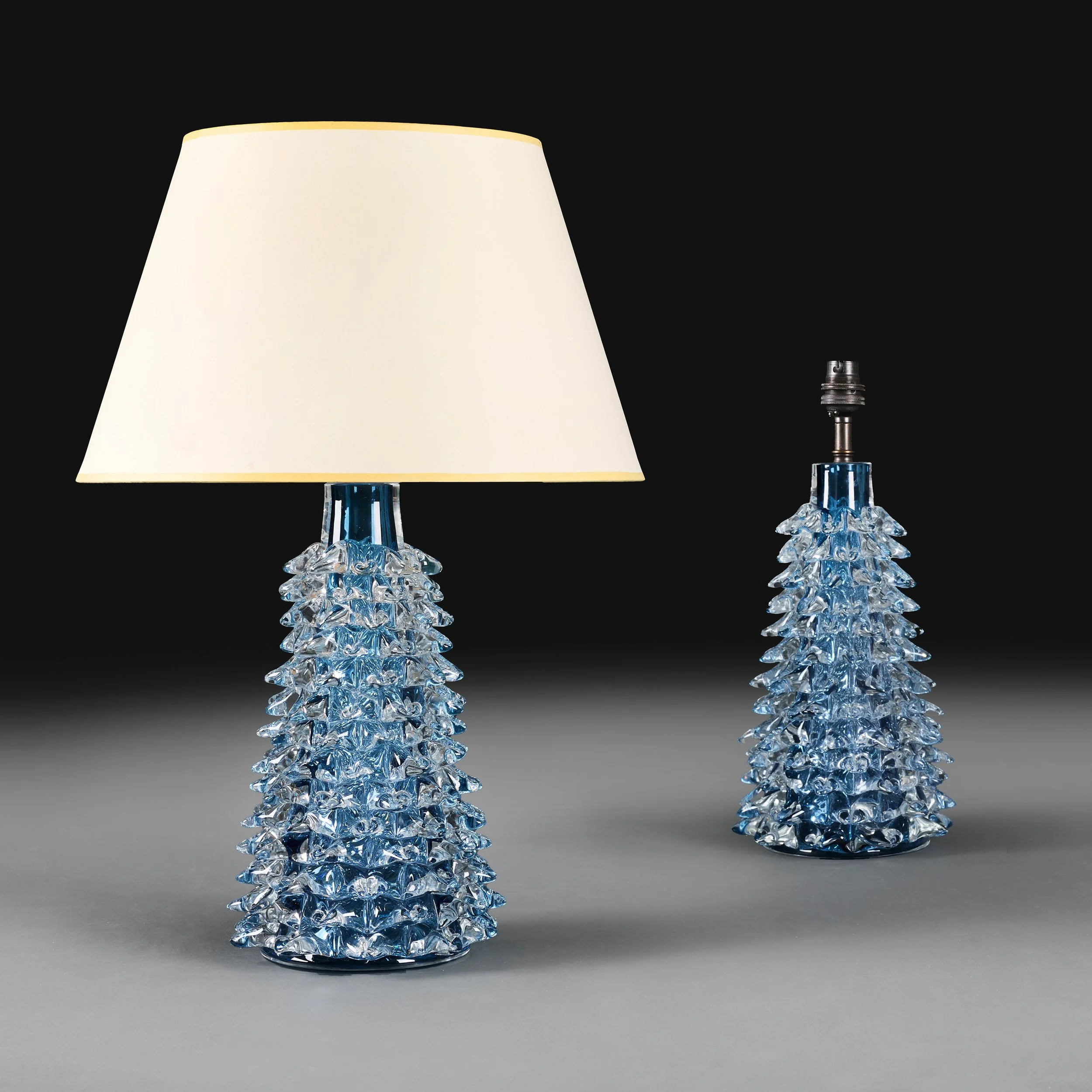 A PAIR OF BLUE ROSTRATO GLASS LAMPS