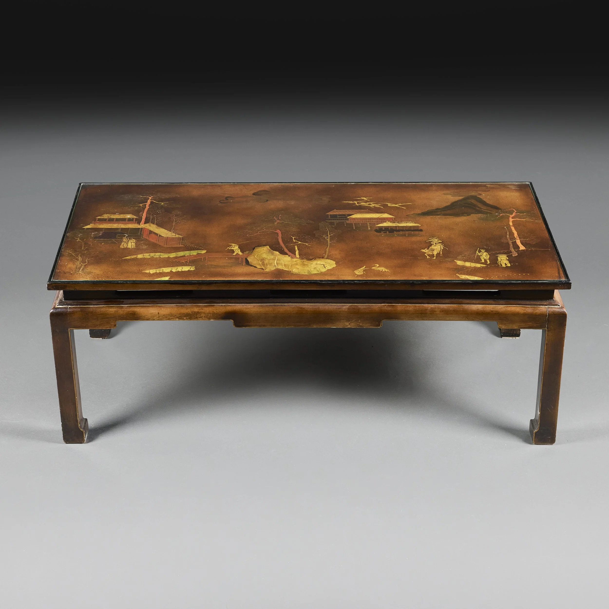 AN UNUSUAL BROWN LACQUER LOW TABLE