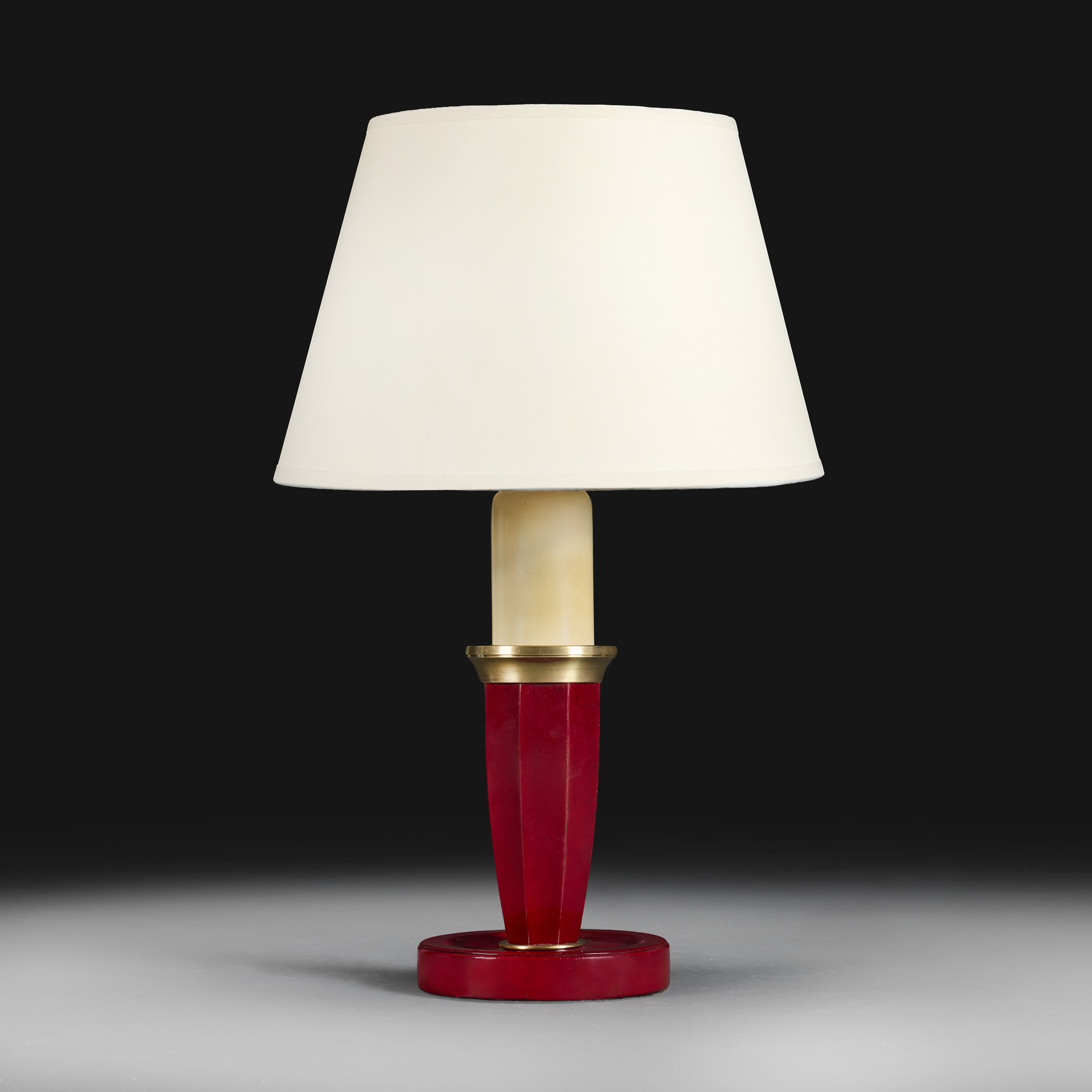 A RED LEATHER DESK LAMP AFTER ADNET