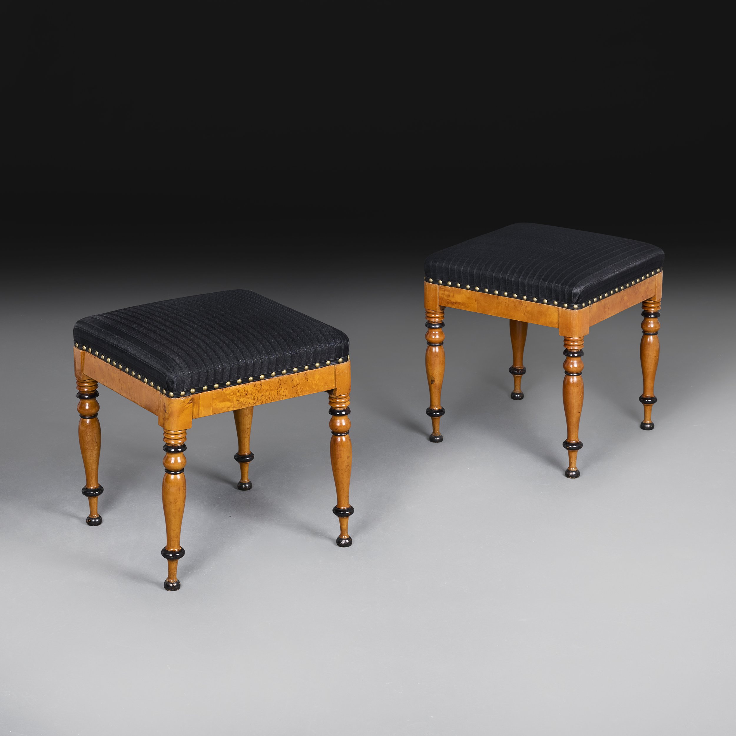 A PAIR OF AUSTRIAN MAPLEWOOD STOOLS