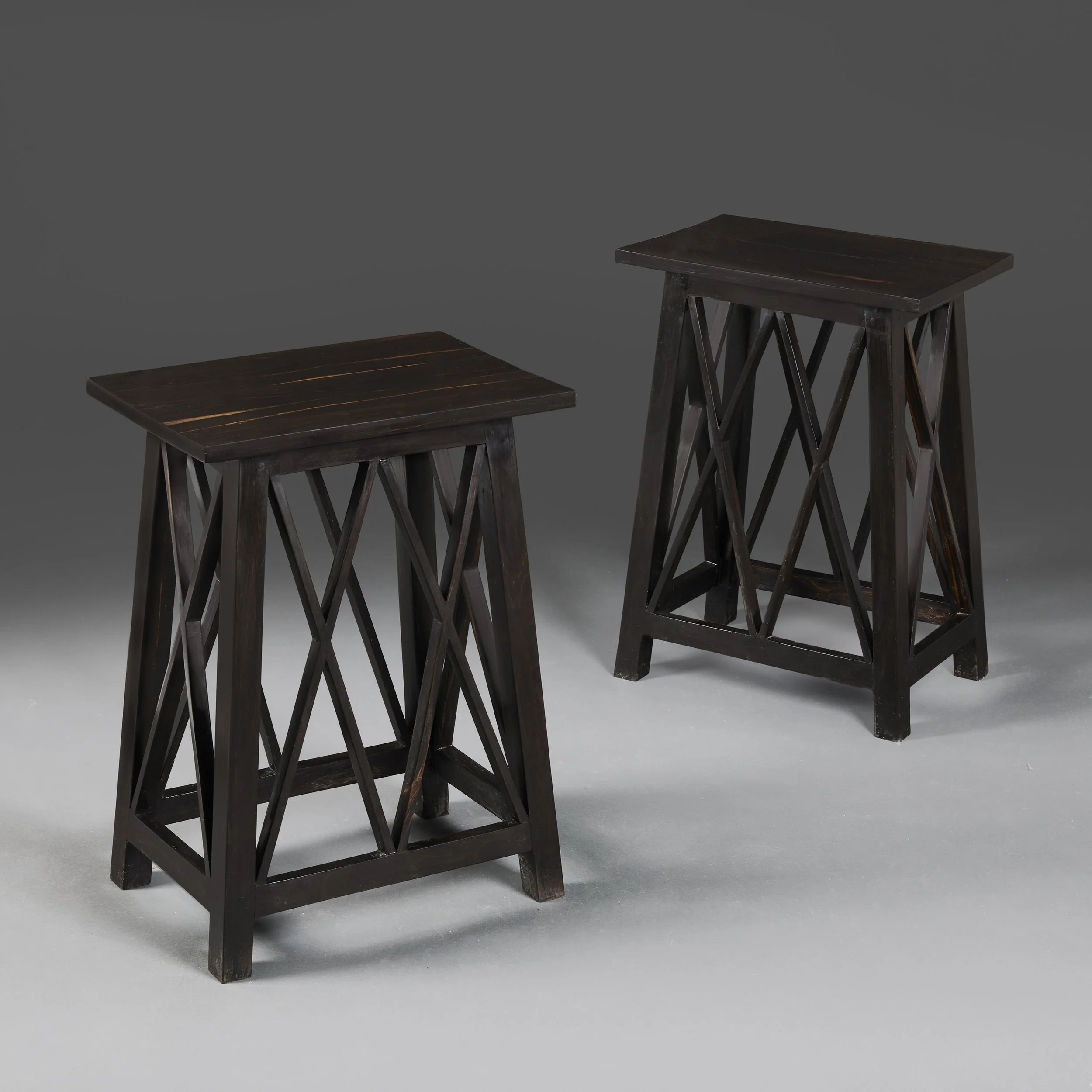 A PAIR OF EBONY ANGO-SINHALESE OCCASIONAL TABLES
