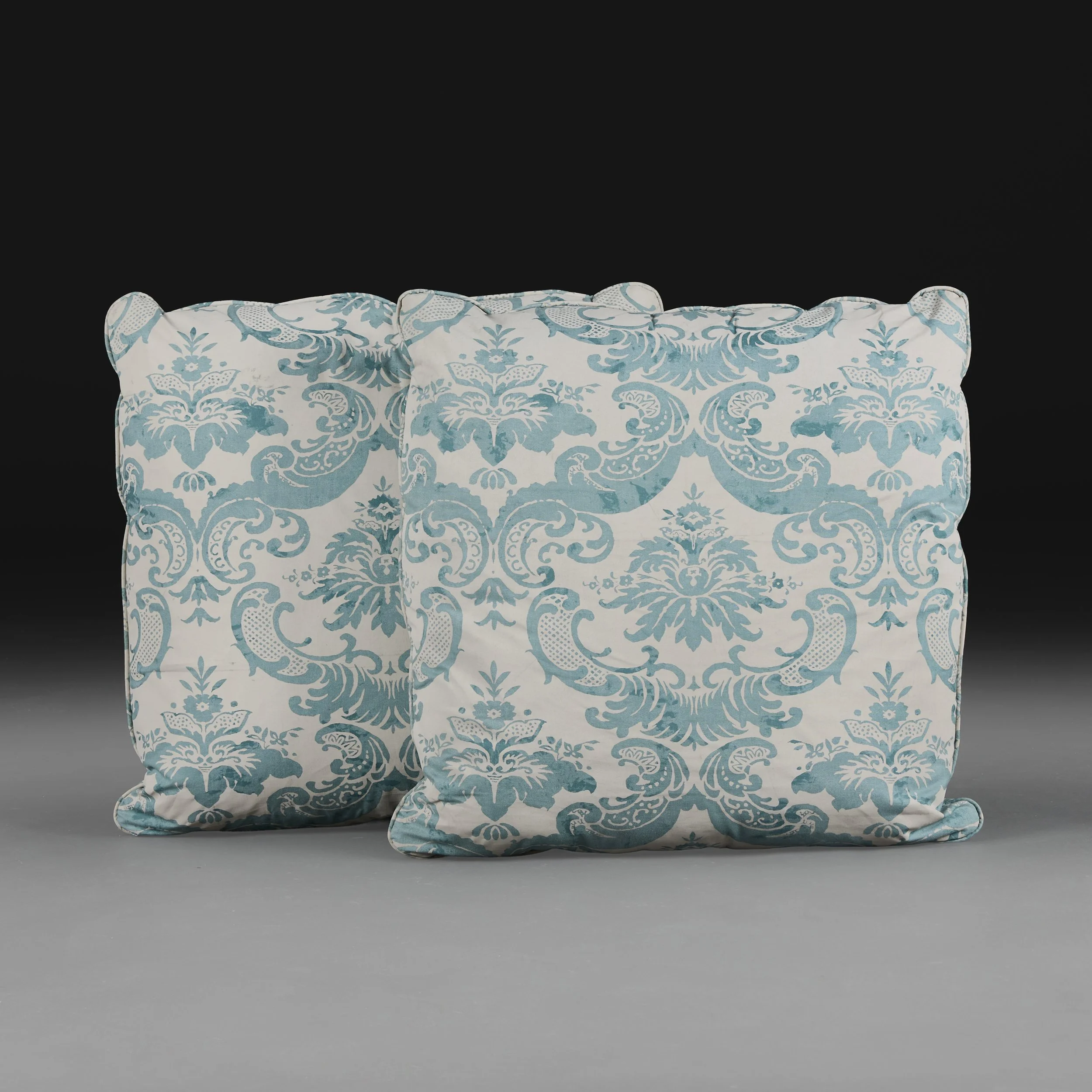 A PAIR OF BLUE AND WHITE FORTUNY STYLE CUSHIONS