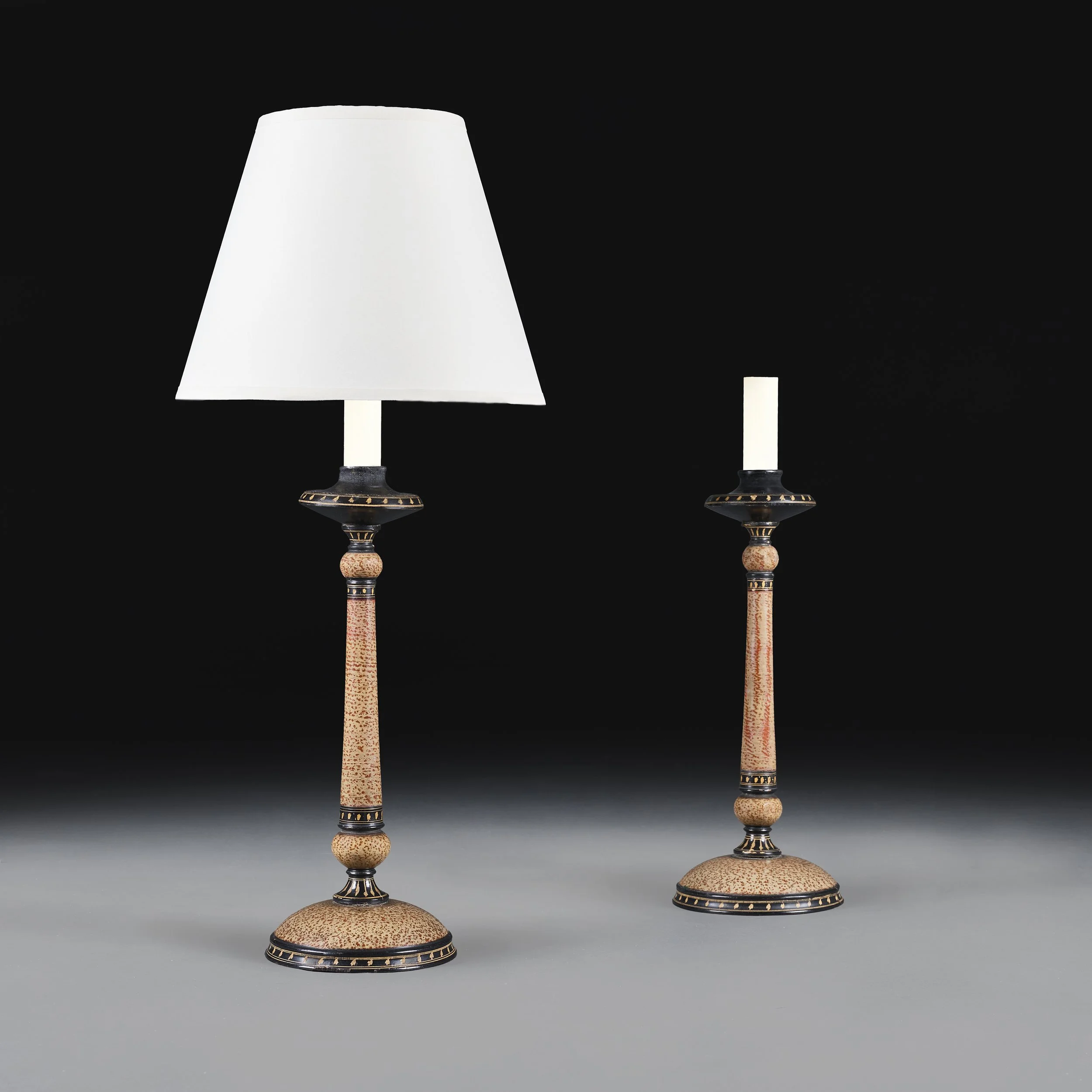 A PAIR OF ANGLO-INDIAN CANDLESTICKS AS LAMPS