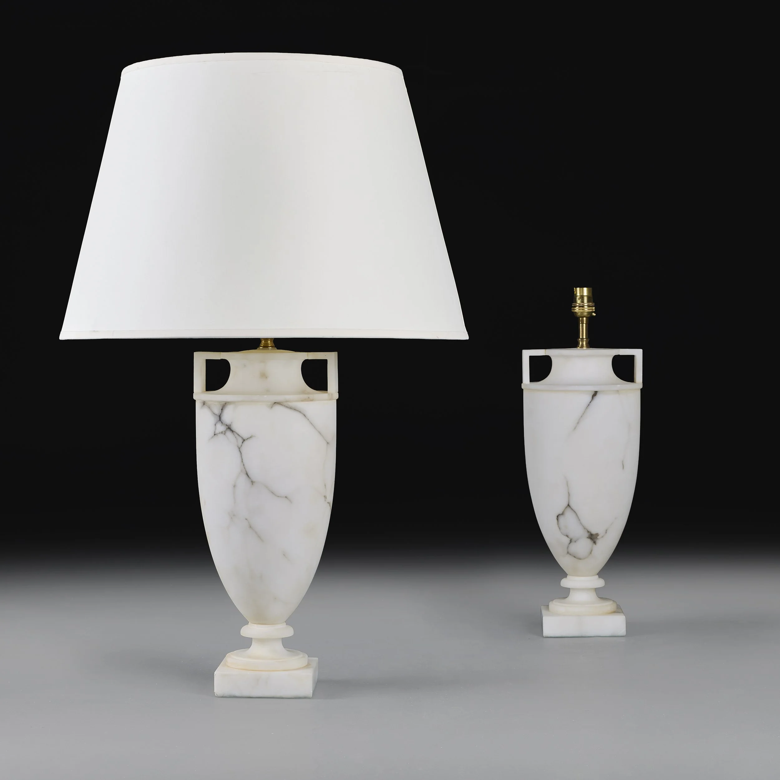A PAIR OF WHITE ALABASTER URN LAMPS