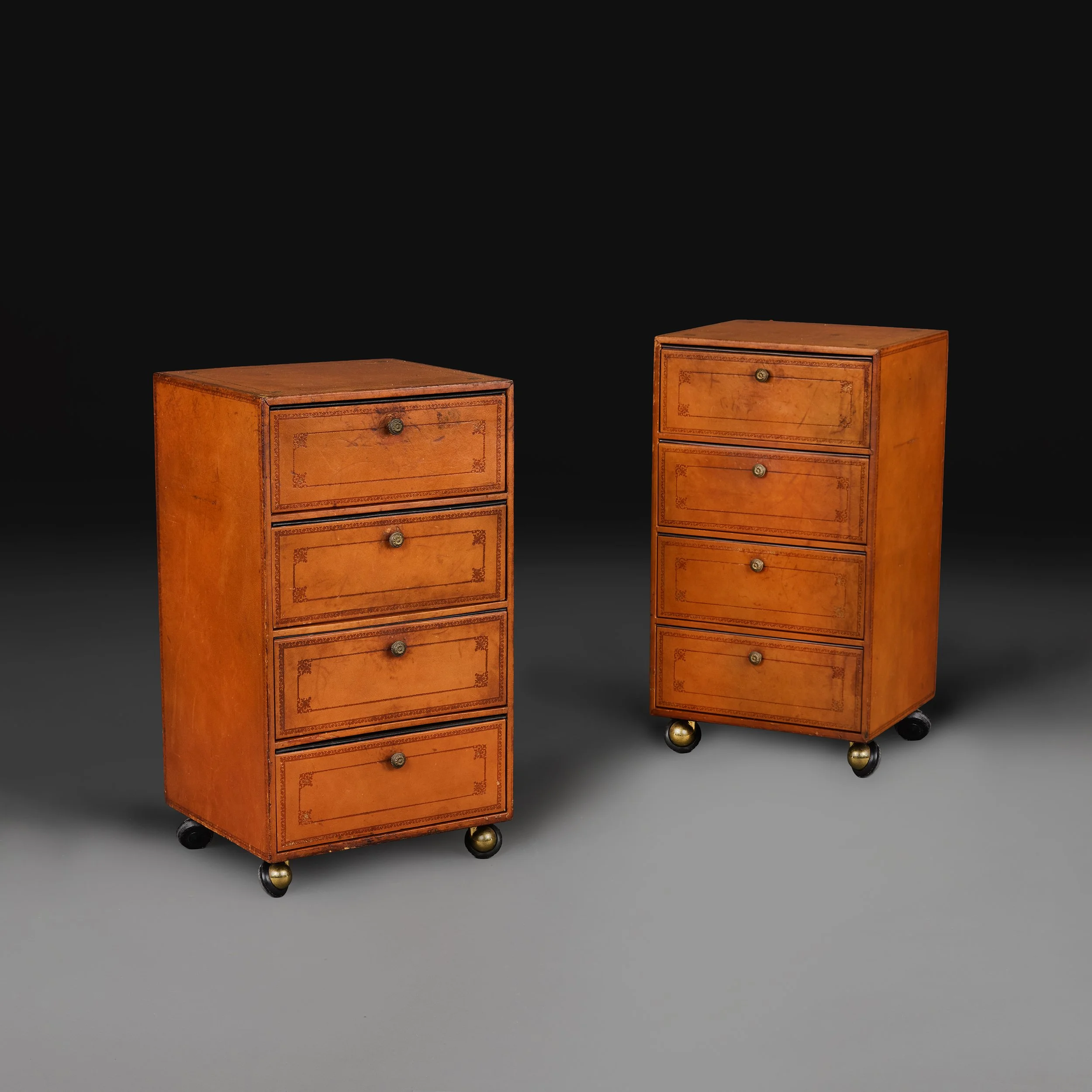 A PAIR OF EDWARDIAN LEATHER CHESTS