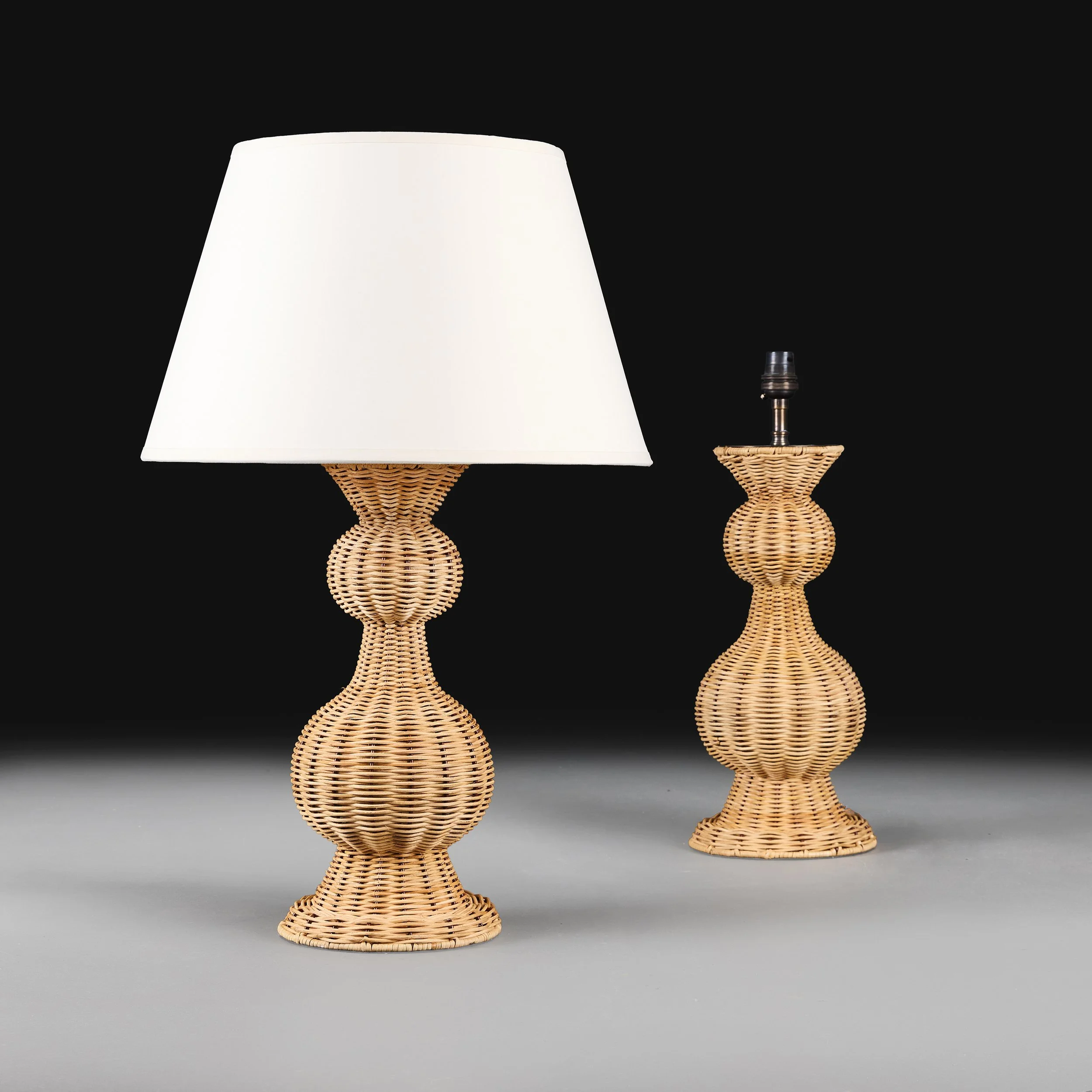 A PAIR OF GARLIC NECK RATTAN LAMPS