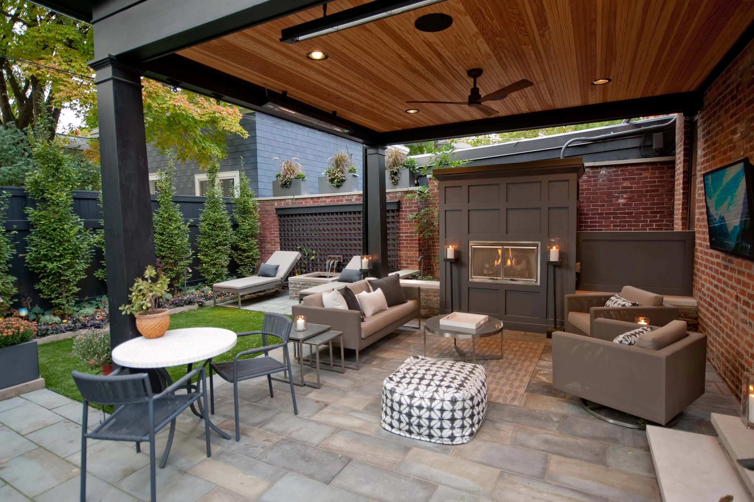 Urban garden and patio with a custom water feature and new fireplace.