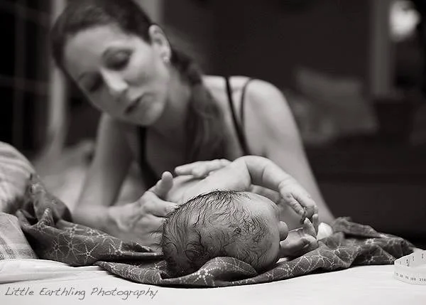 Midwife-Naomi-Bjorgan-LM-Performing-Newborn-Exam-After-Home-Birth-In-Redding-California