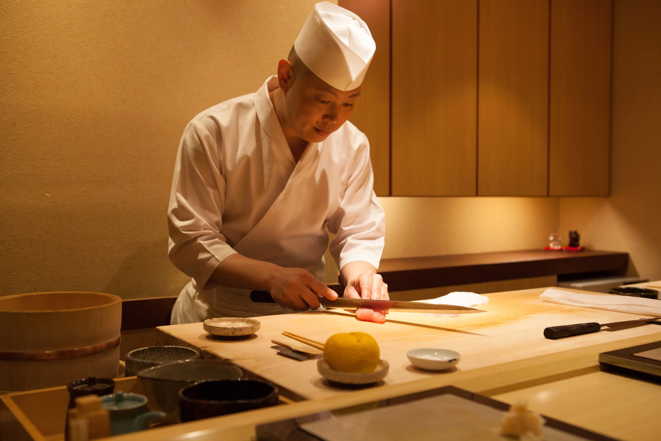 Head Chef cutting some delicious sushi! 