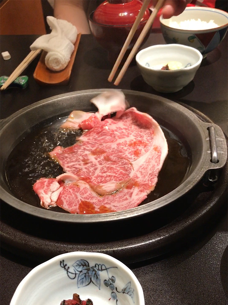 First, they add some of the water and poaching liquid and add the delicious marbled meat