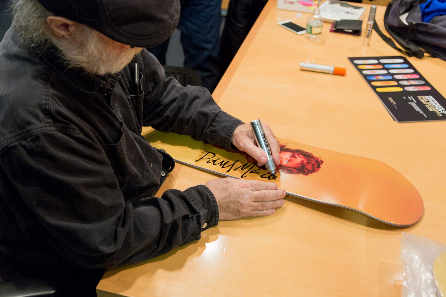 Paul McCarthy signs boards at MOMA