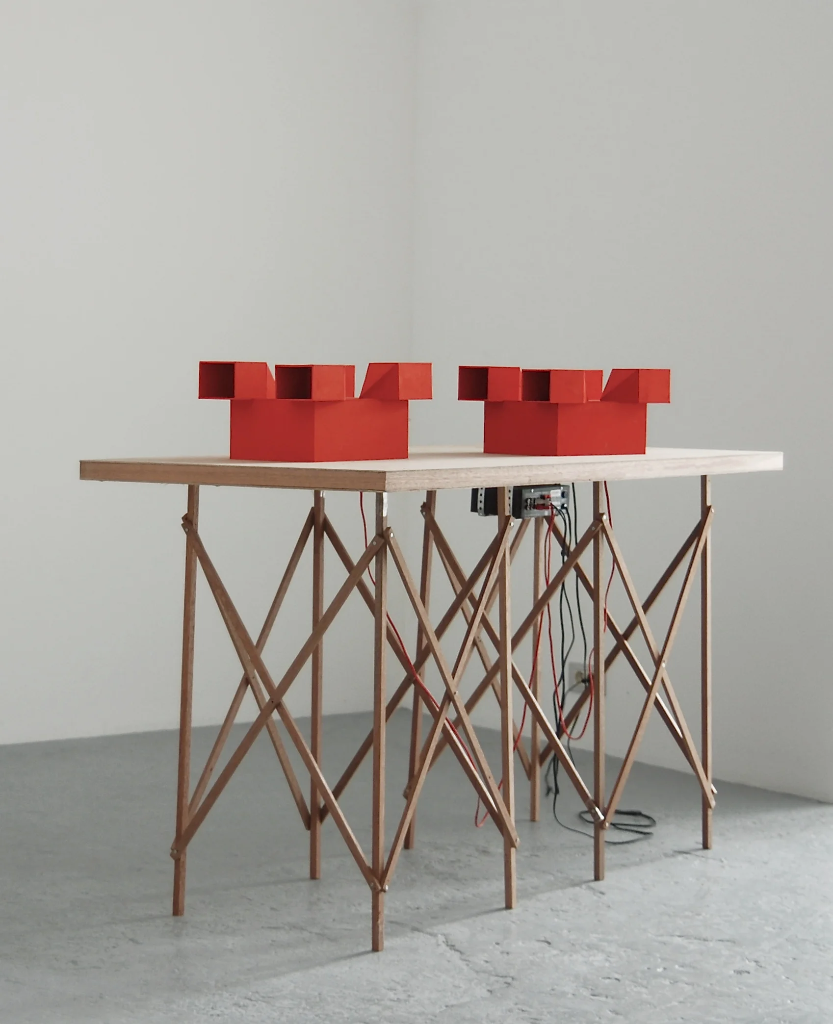Jean-Pascal Flavien, Discussion, 2007, table, cardboard models, speakers, ipod, sound, 105 x 150 x 70 cm