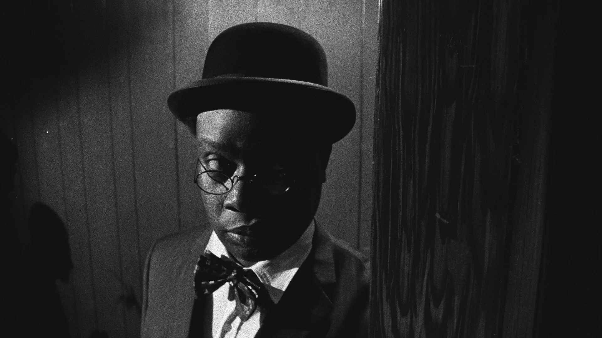 Catherine Sullivan, Triangle of Need, 2007. In collaboration with Sean Griffin, Dylan Skybrook, and Kunle Afolayan Triangle of need ( Chicago) , 3 channel projection, 16 mm film transferred to digital media, black & white, sound, 19’32 minutes