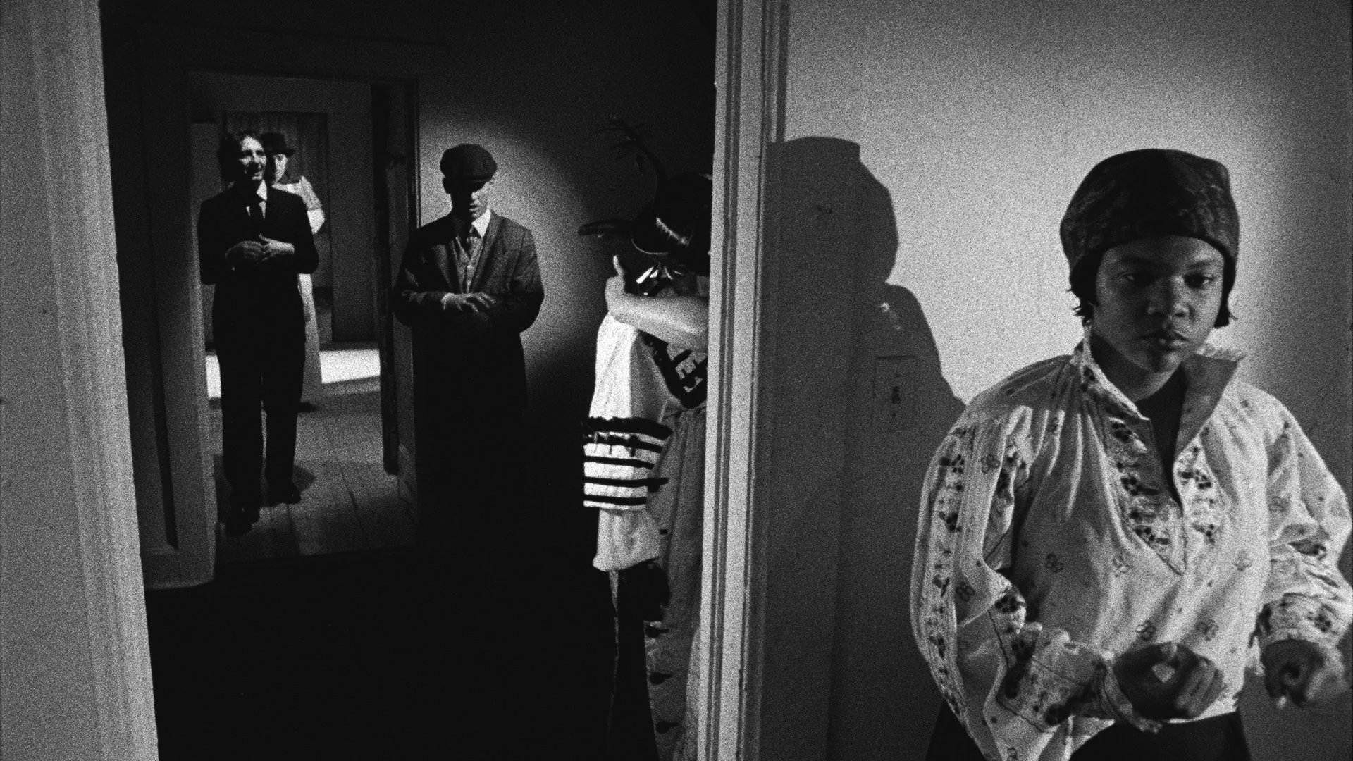 Catherine Sullivan, Triangle of Need, 2007. In collaboration with Sean Griffin, Dylan Skybrook, and Kunle Afolayan Triangle of need ( Chicago) , 3 channel projection, 16 mm film transferred to digital media, black & white, sound, 19’32 minutes