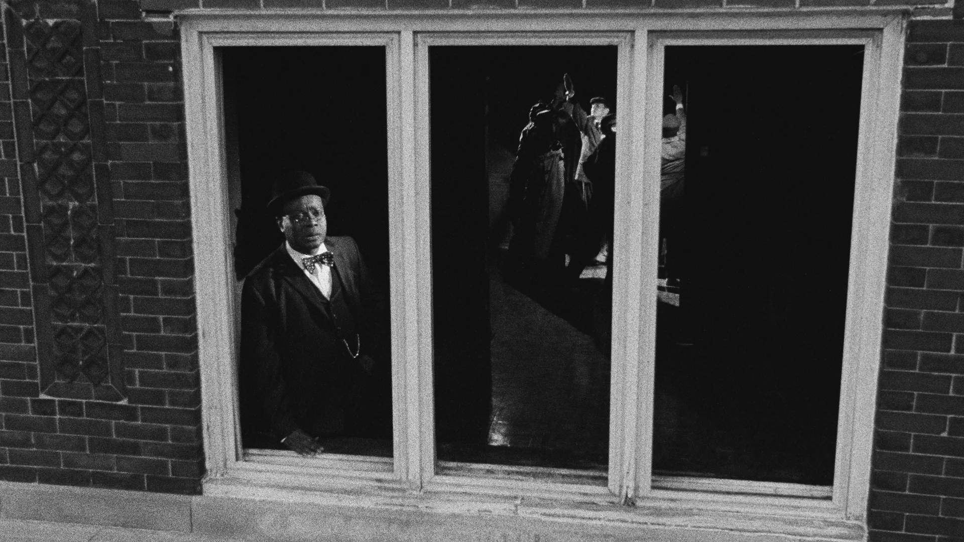 Catherine Sulliva, Triangle of Need, 2007. In collaboration with Sean Griffin, Dylan Skybrook, and Kunle Afolayan Triangle of need ( Chicago) , 3 channel projection, 16 mm film transferred to digital media, black & white, sound, 19’32 minutes
