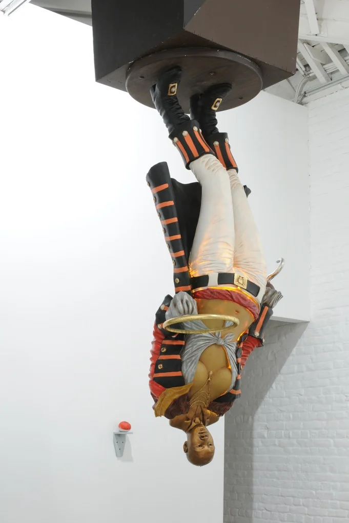  A Vessel in a Vessel in a Vessel and So On , 2007, sculpture - Pirate lady statue, Martin Luther King Jr plaster bust, wood, pump, light, chocolate, 304 x 91 x 91 cm, ed. 1/3
