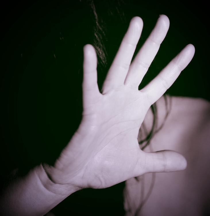 Trans Person Hand Up Out of Fear (cc0)
