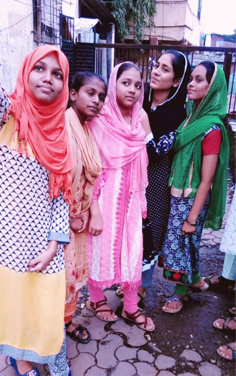 Samina (orange scarf) with her friends