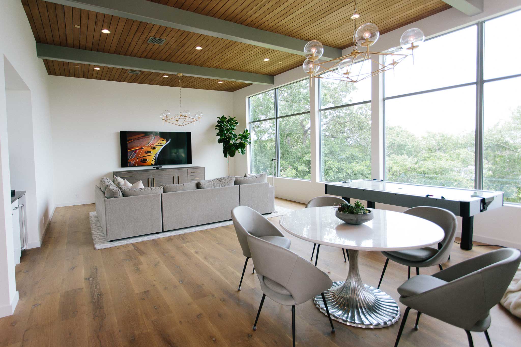 The family room boasts an 85" TV and is the perfect space to spend quality time