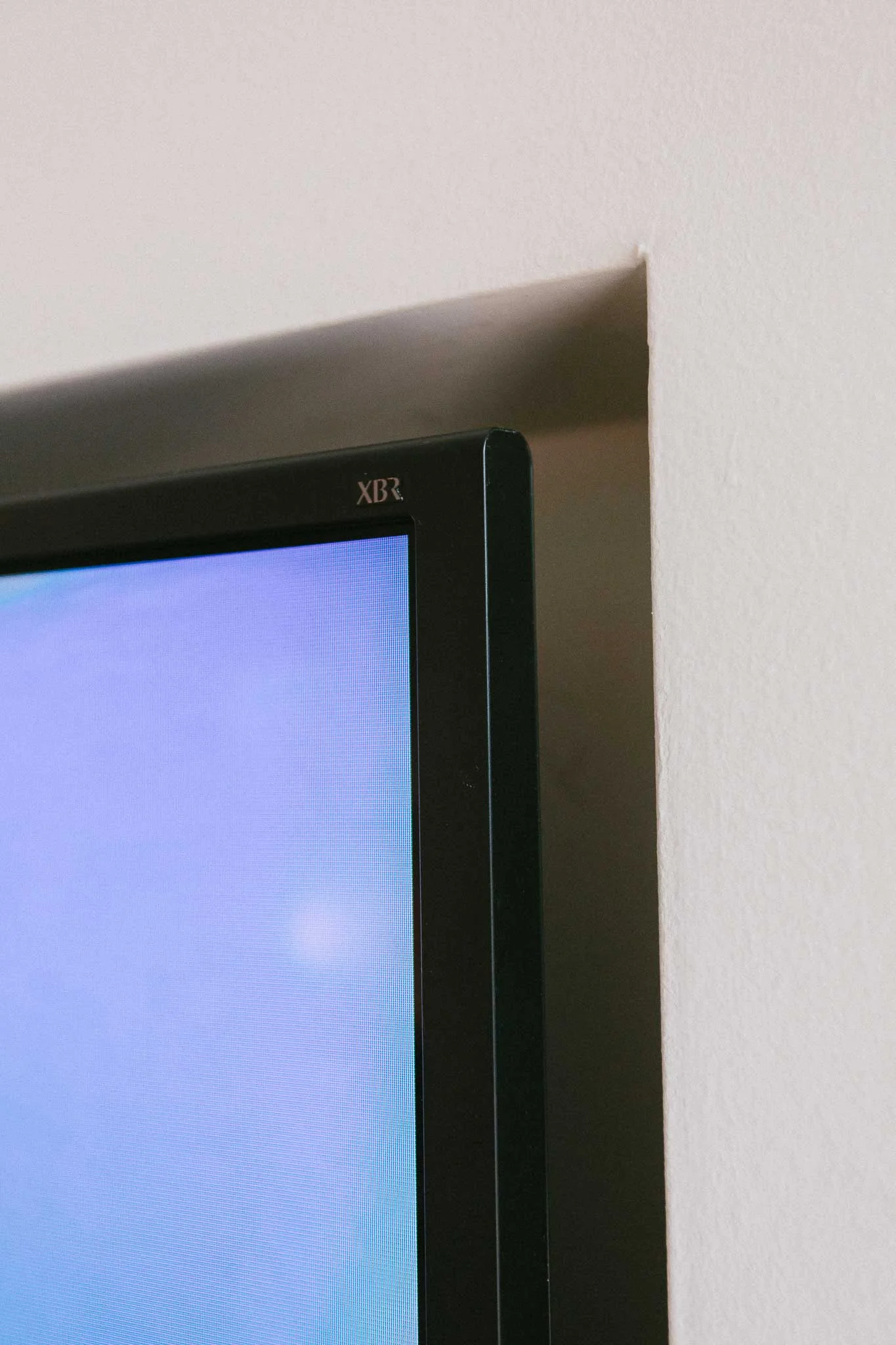 Precision and careful measurements were key in installing the 65" TV into a recessed pocket