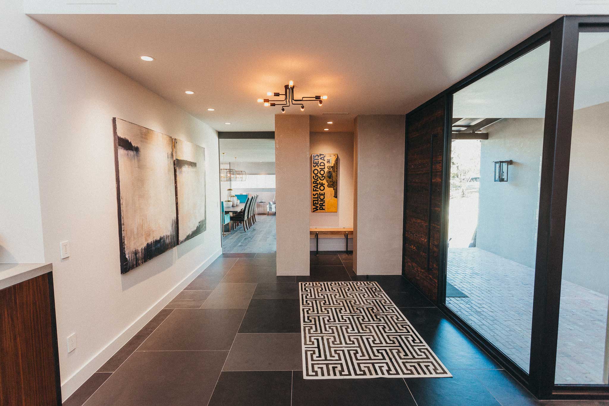 Our whole home system greets you at the front door with invisible speakers, hidden behind the ceiling drywall