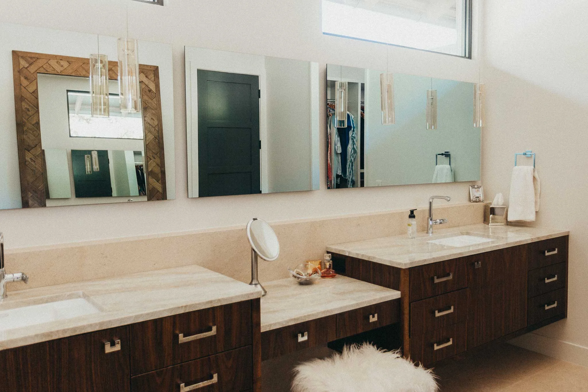 One of the favorite aspects of this project is the Seura mirror TV, which appears in the vanity mirror at the press of a button