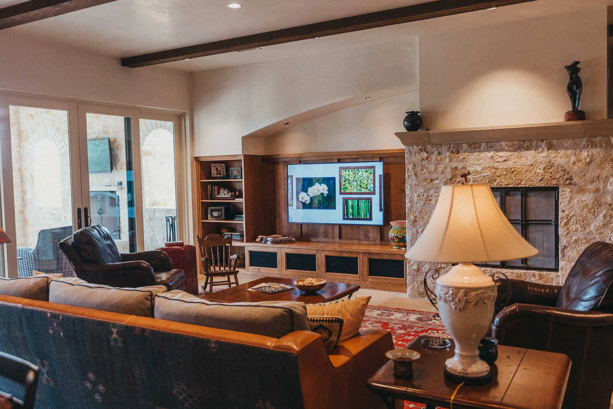 The spacious living room opens up to the outdoor living space and has gorgeous views of the lake