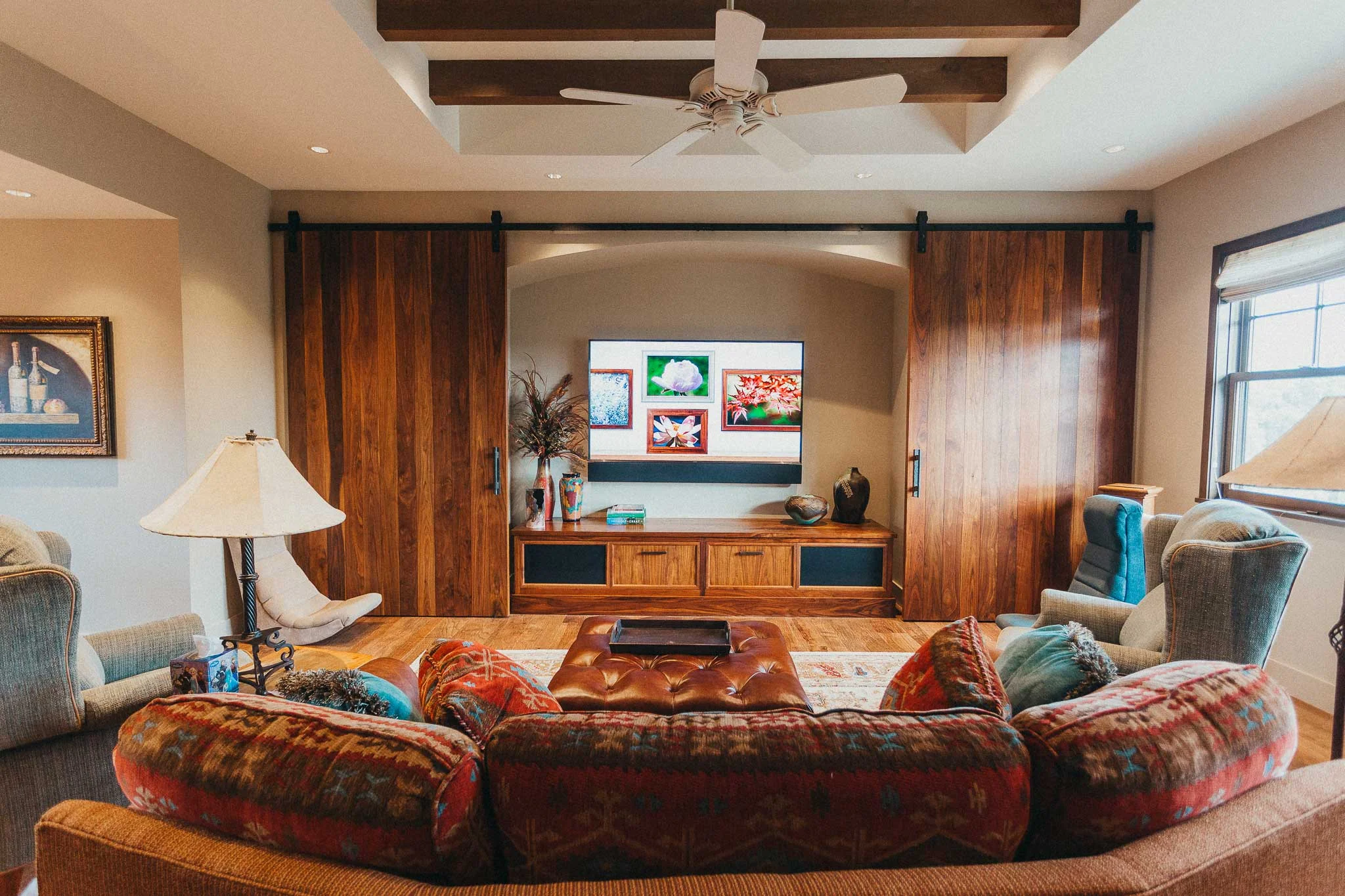 A custom aspect to the popular game room is the barn doors that hide the 75" 4K TV
