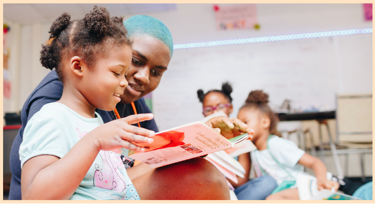 Child reading at Emmaus House Freedom School summer program.