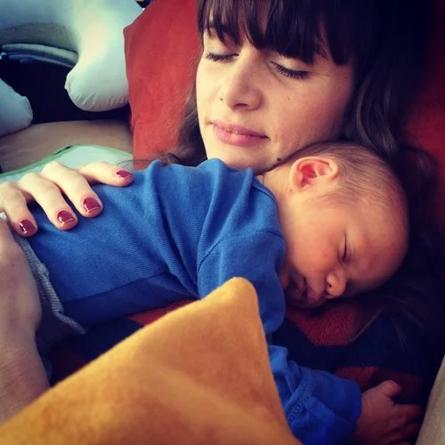 Woman Holding Sleeping Infant.jpeg