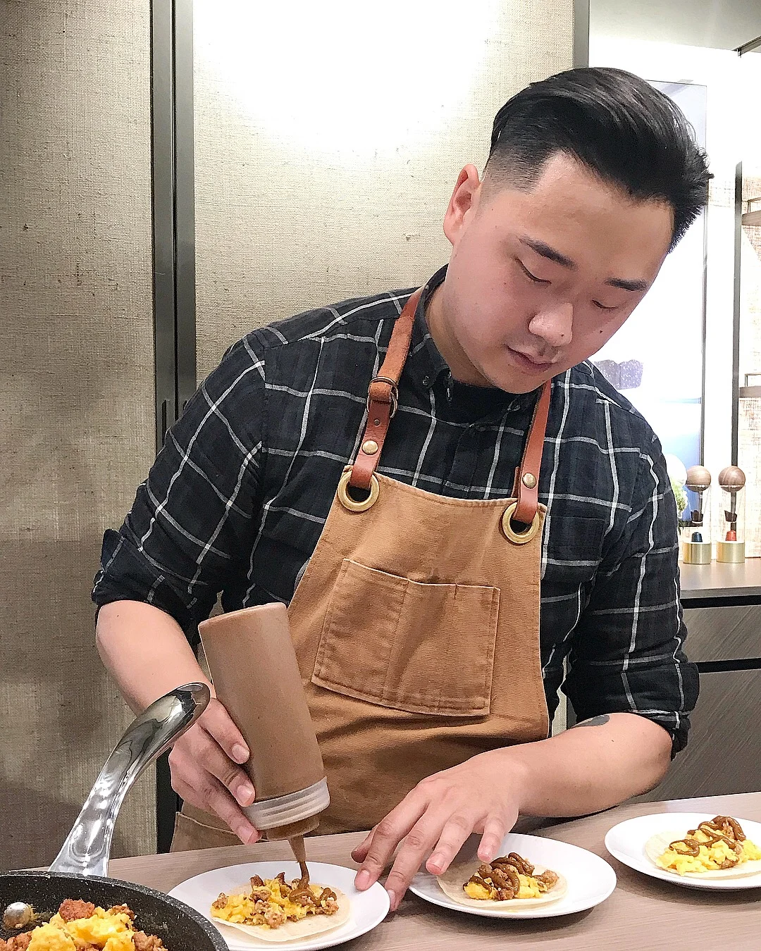 Vancouver Chef Juno Kim preparing Chorizo, Swiss Chard & Egg Tacos with Nespresso Double Espresso infused Adobo Crema.