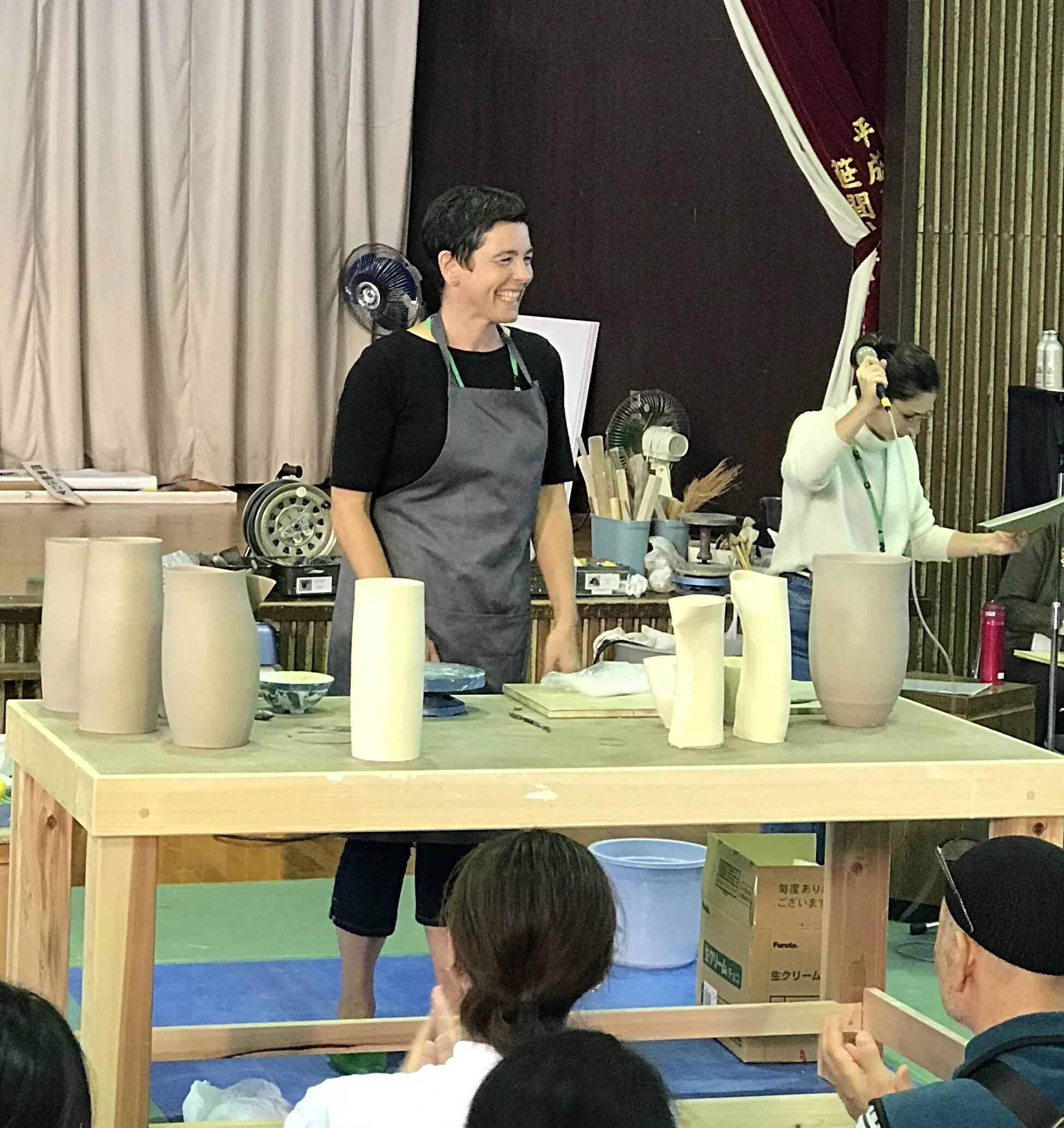 Sarah Flynn Demonstrating her method of manipulating leather hard thrown shapes.